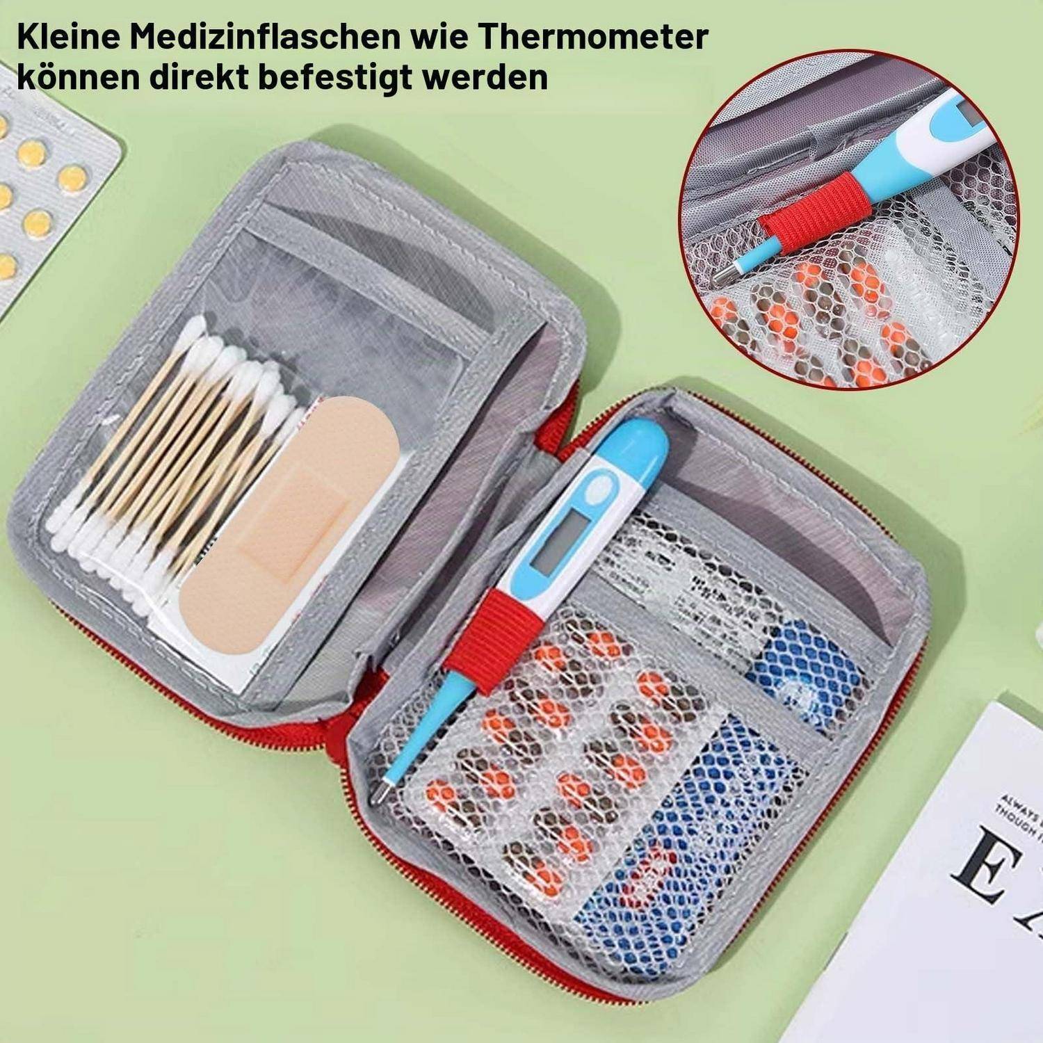 Offenes medizinisches Lagerkassette mit Netztaschen, die Tupfer, Haftverbandsmaterial und ein digitales Thermometer halten; die Einschub zeigt das Thermometer an Ort und Stelle festgeschnallt.