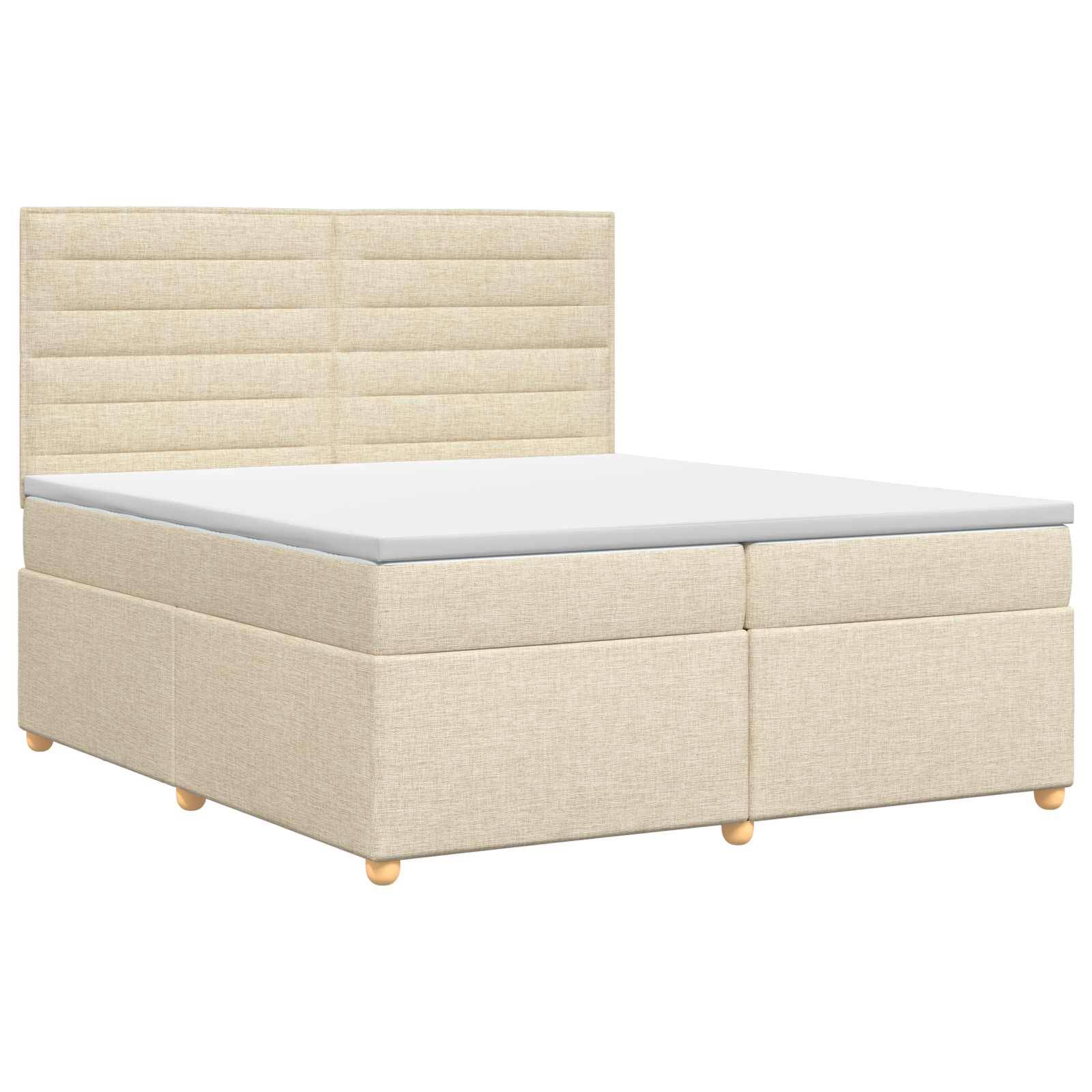 Beige gepolstertes Bett mit Stauraum, gepolstertem Kopfteil und weißer Matratze auf Holzfüßen, auf weißem Hintergrund dargestellt.