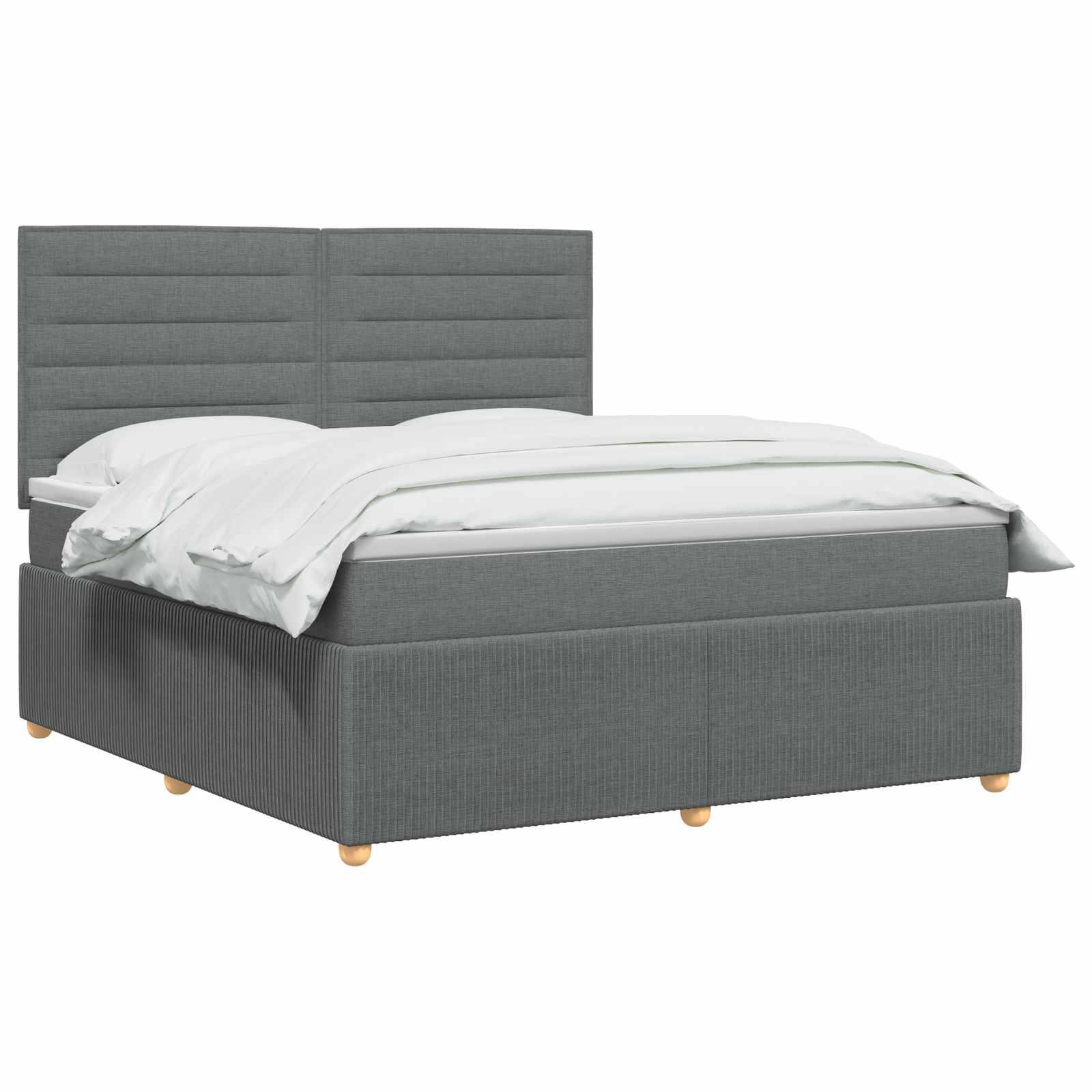 Grau gepolstertes Bett mit gepolstertem Kopfteil und weißer Bettwäsche auf einfachem weißem Hintergrund.