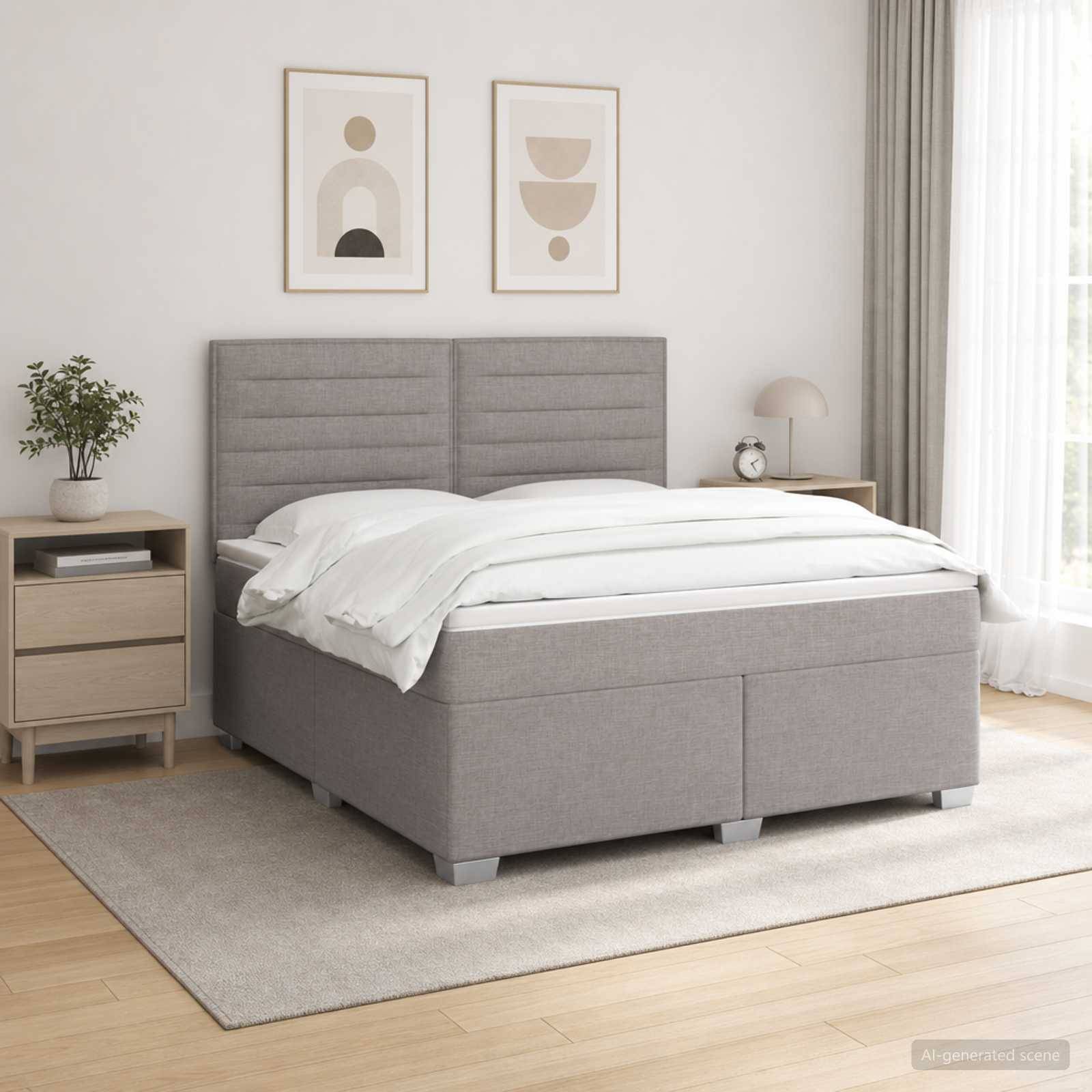 Modernes Schlafzimmer mit einem grau gepolsterten Bett, weißer Bettwäsche, Nachttisch, gerahmtem Wandbild und weichem natürlichem Licht aus einem Fenster.
