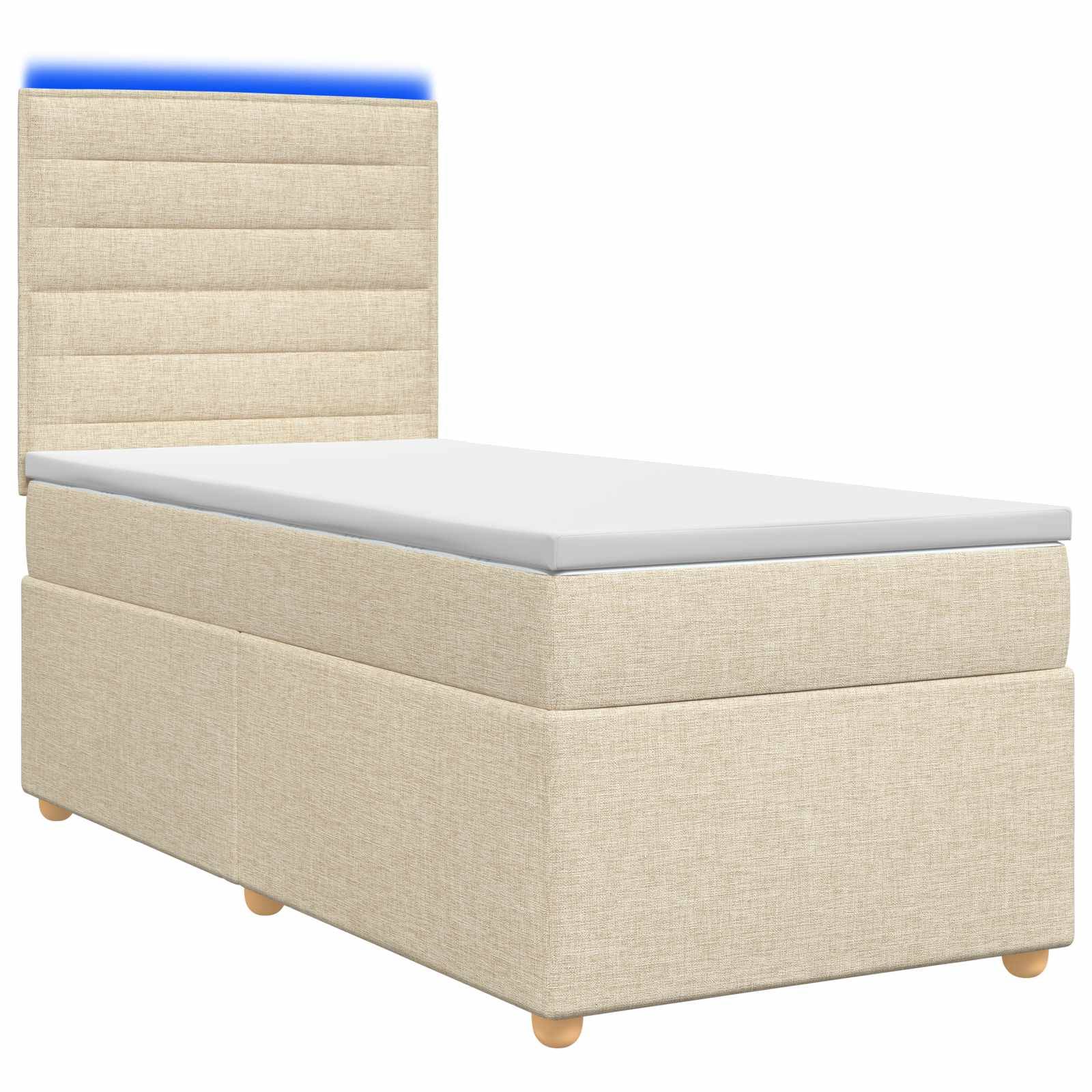 Beige gepolstertes Einzelbett mit hohem gepolstertem Kopfteil, weiße Matratze und Holzfüße auf weißem Hintergrund.