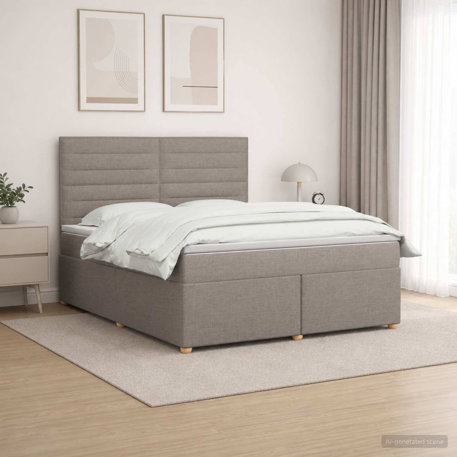Modernes Schlafzimmer mit einem grau gepolsterten Bett, weißer Bettwäsche, Nachttisch, gerahmter Wandkunst und weicher, neutraler Einrichtung in einem hellen Raum.