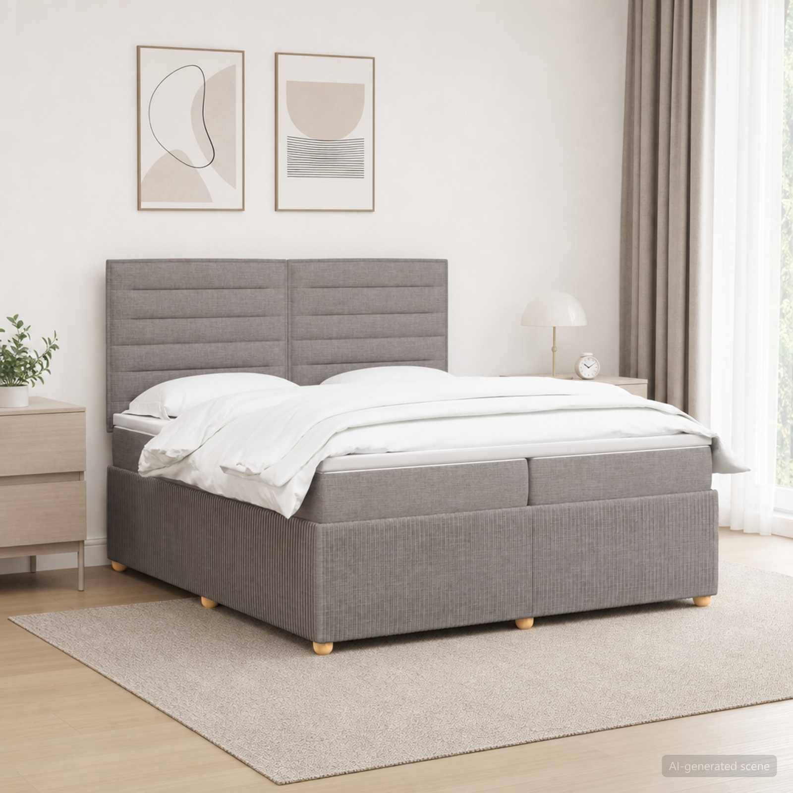 Modernes grau gepolstertes Bett mit weißer Bettwäsche in einem hellen, minimalistischen Schlafzimmer, mit gerahmten Wandbildern, Nachttisch, Lampe und Teppich.