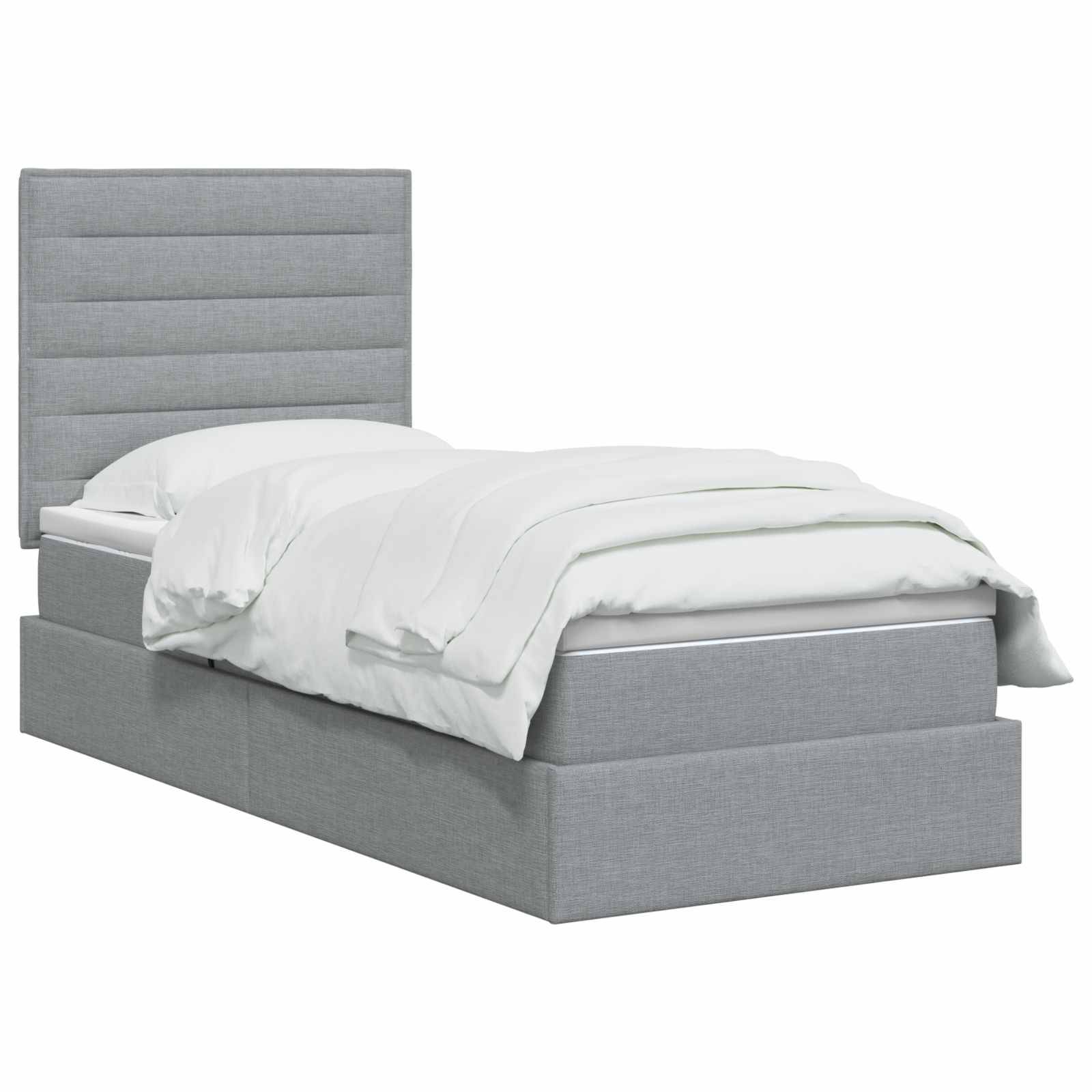 Grau gepolstertes Bett mit hohem gepolstertem Kopfteil und weißer Bettwäsche auf einfachem weißem Hintergrund.