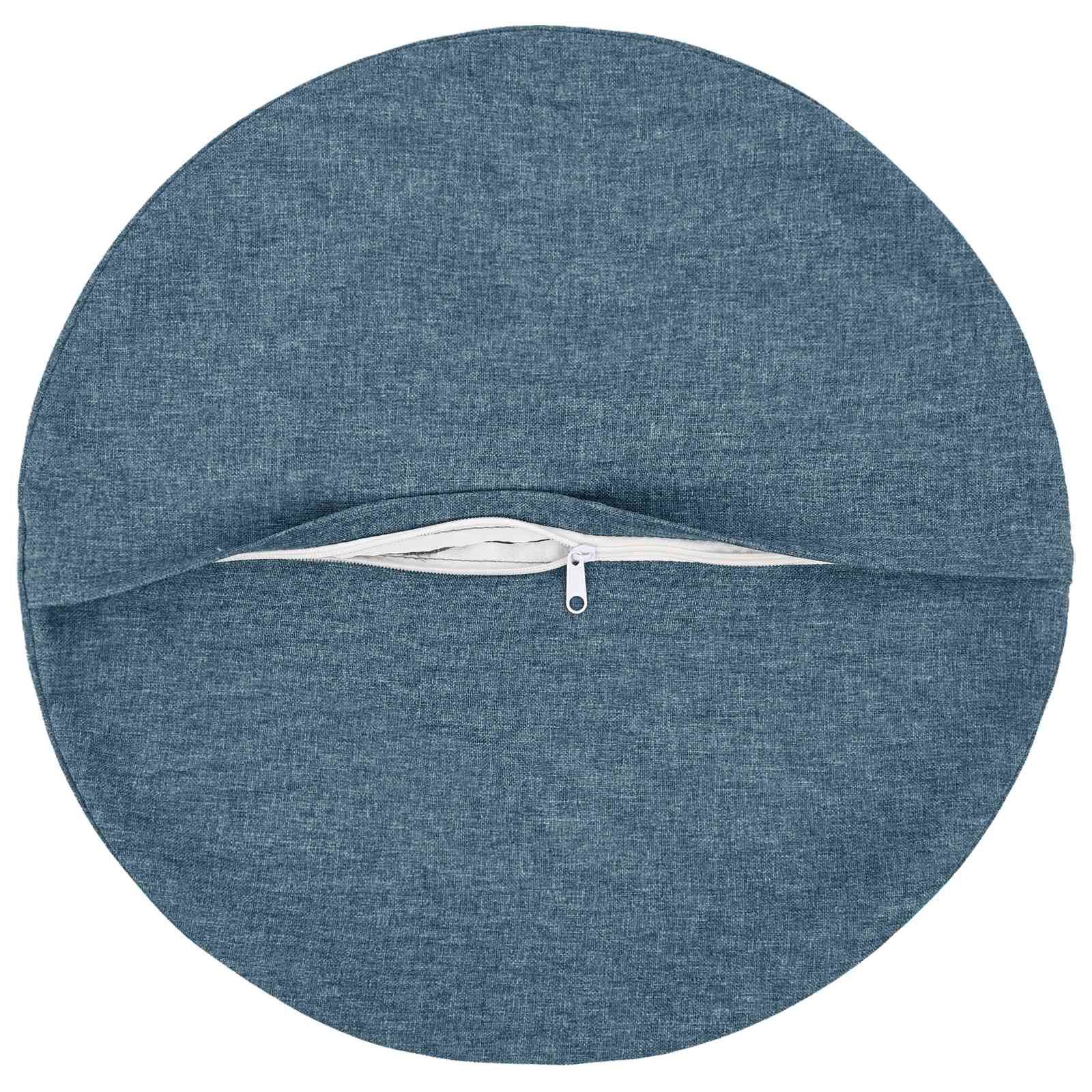 Rundes blaues Stoffkissen oder Sitzkissen mit einem horizontalen Reißverschluss in der Mitte.