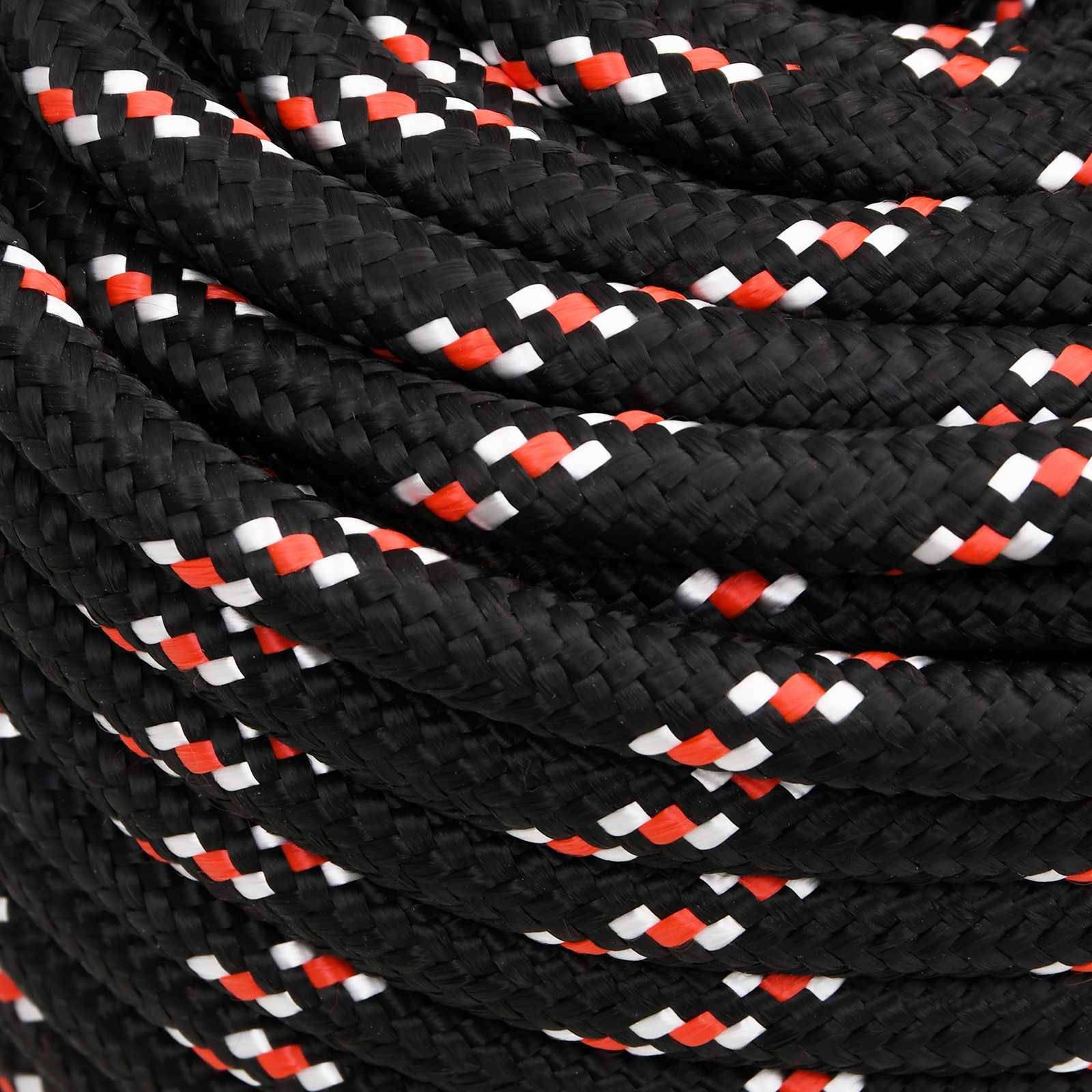 Nahaufnahme eines eng geflochtenen schwarzen Seils mit rot-, weiß- und schwarzgewobenen Fäden.