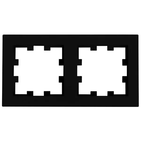 Schwarzes rechteckiges Symbol mit zwei nebeneinander angeordneten weißen gezackten quadratischen Aussparungen, die ein Dual-Port oder Anschlussfeld ähneln.