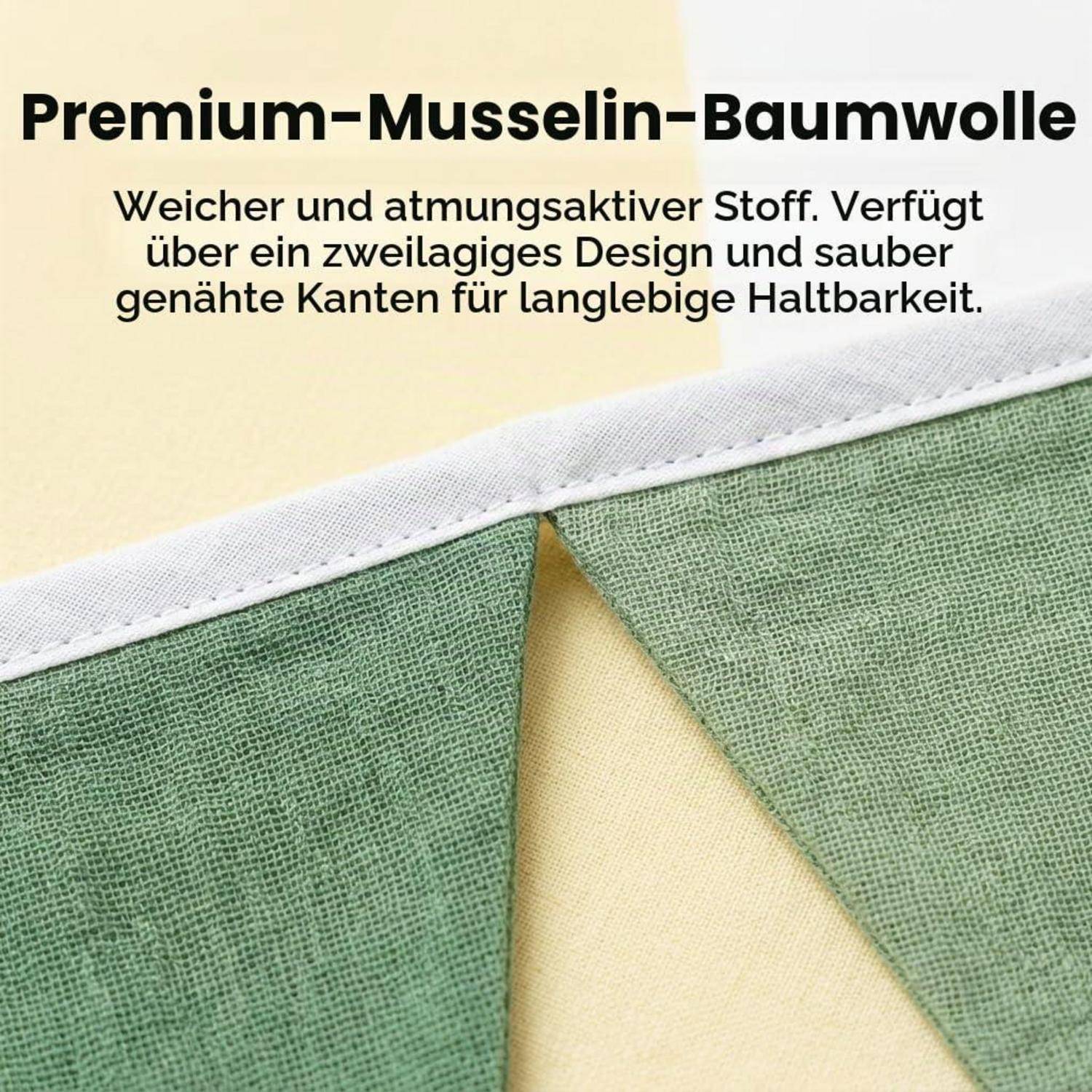 Nahaufnahme von grünem Premium-Musselin-Baumwollstoff mit weiß gesäumter Kante; deutscher Text besagt, dass er weich, atmungsaktiv, zwei-schichtig und langlebig ist.
