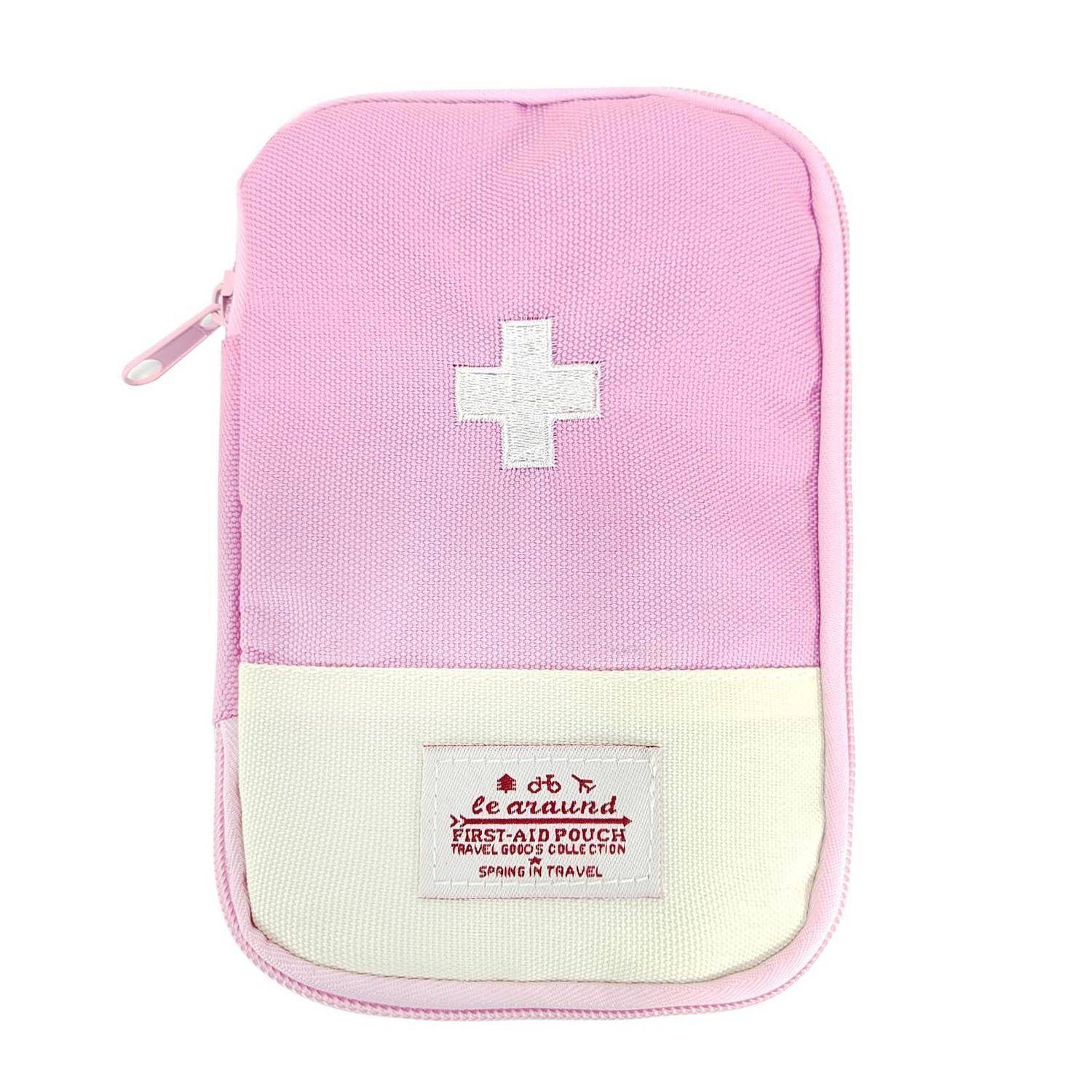 Rosa Erste-Hilfe-Tasche mit weißem Kreuz und Vorderetikett, gezeigt vor einem einfachen weißen Hintergrund.