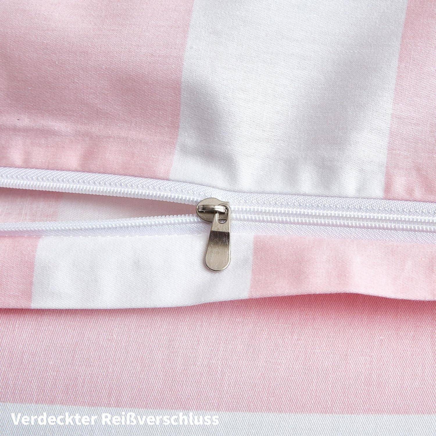 Nahaufnahme eines rosa-weiß gestreiften Stoffes mit einem versteckten Reißverschluss und einer Zuglasche.