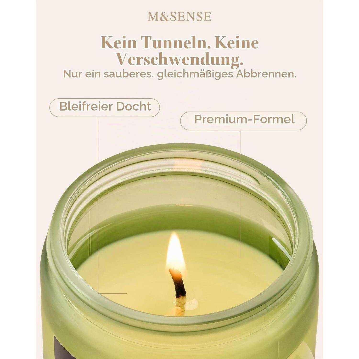 M&SENSE Kerzenanzeige mit einer brennenden grünen Glaskerze mit deutschem Text: „Kein Tunneling, kein Verschwendung" und Beschriftungen „Bleifreier Docht"" und „Prämiumformel"".