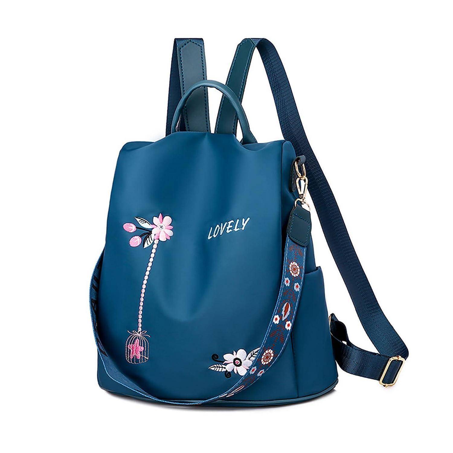 Blauer Rucksack mit Blumenstickerei und dem Wort 