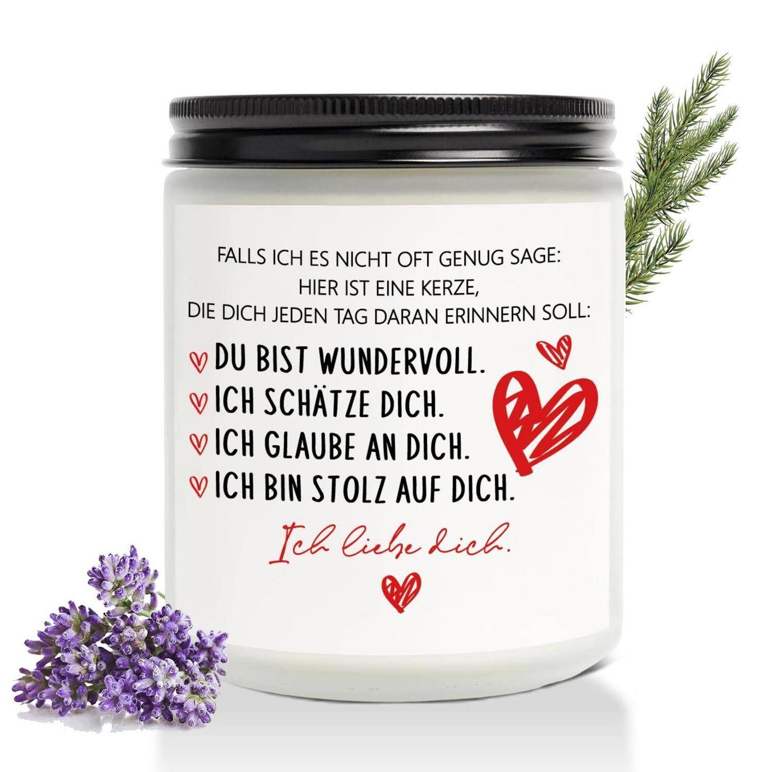 Eine weiße Glaskerze mit deutschem Wertschätzungstext, auf dem „Du bist wundervoll