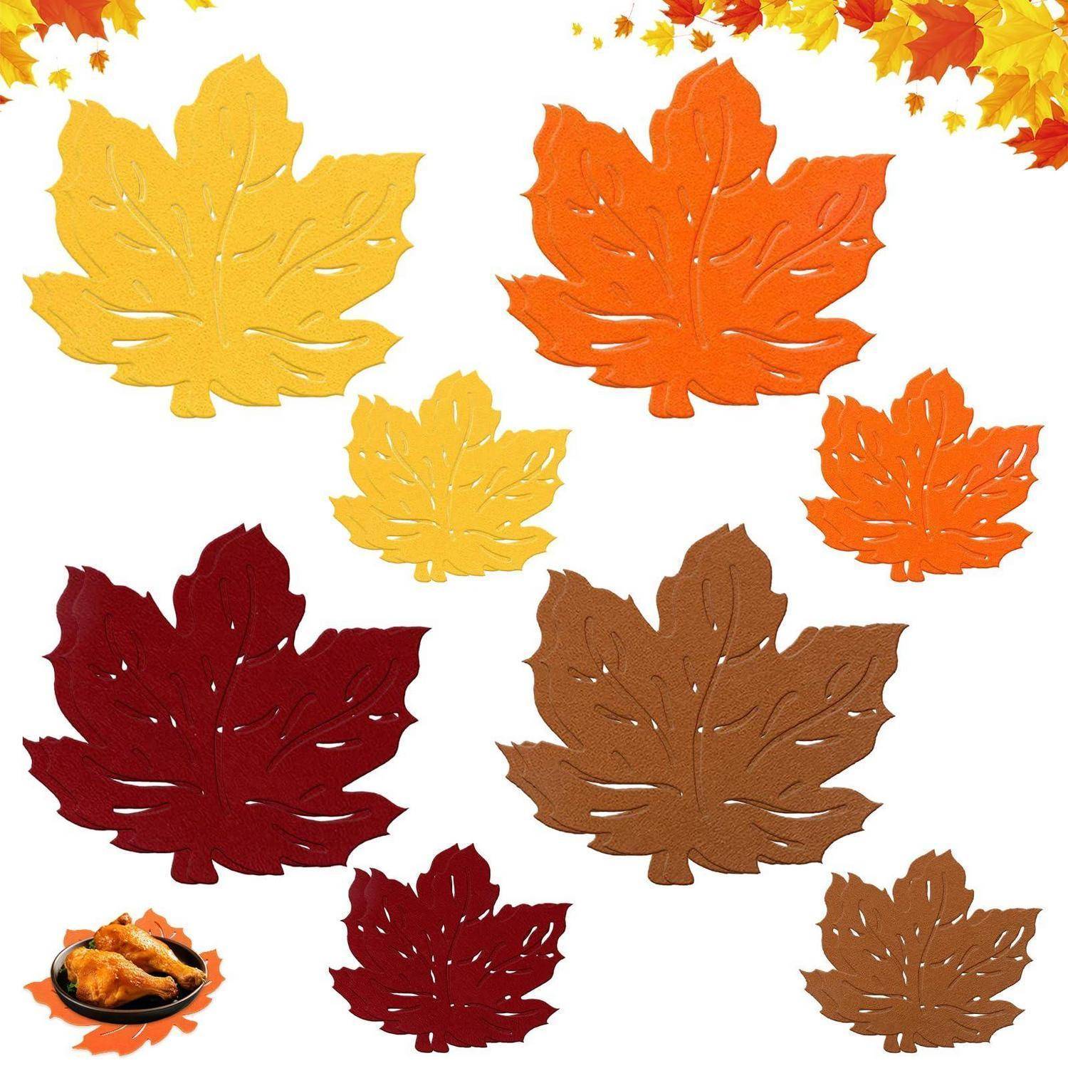 Eine Gruppe bunter Herbstahornblätter in Gelb, Orange, Rot und Braun auf weißem Hintergrund.