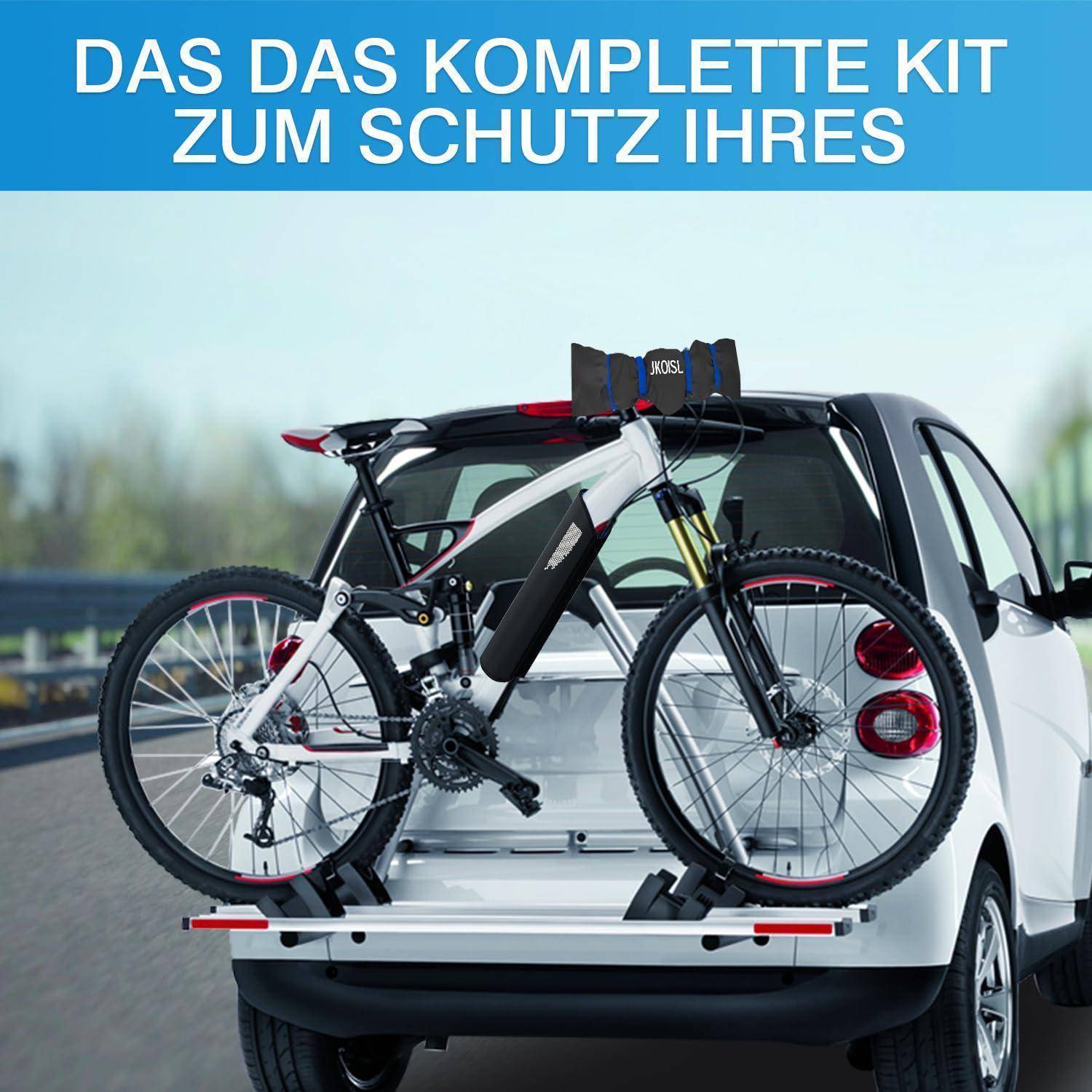 Pickup-Laster mit einem Mountainbike auf einem hinten angebrachten Ständer, der oben ein komplettes Schutzset mit deutschem Text bewirbt.