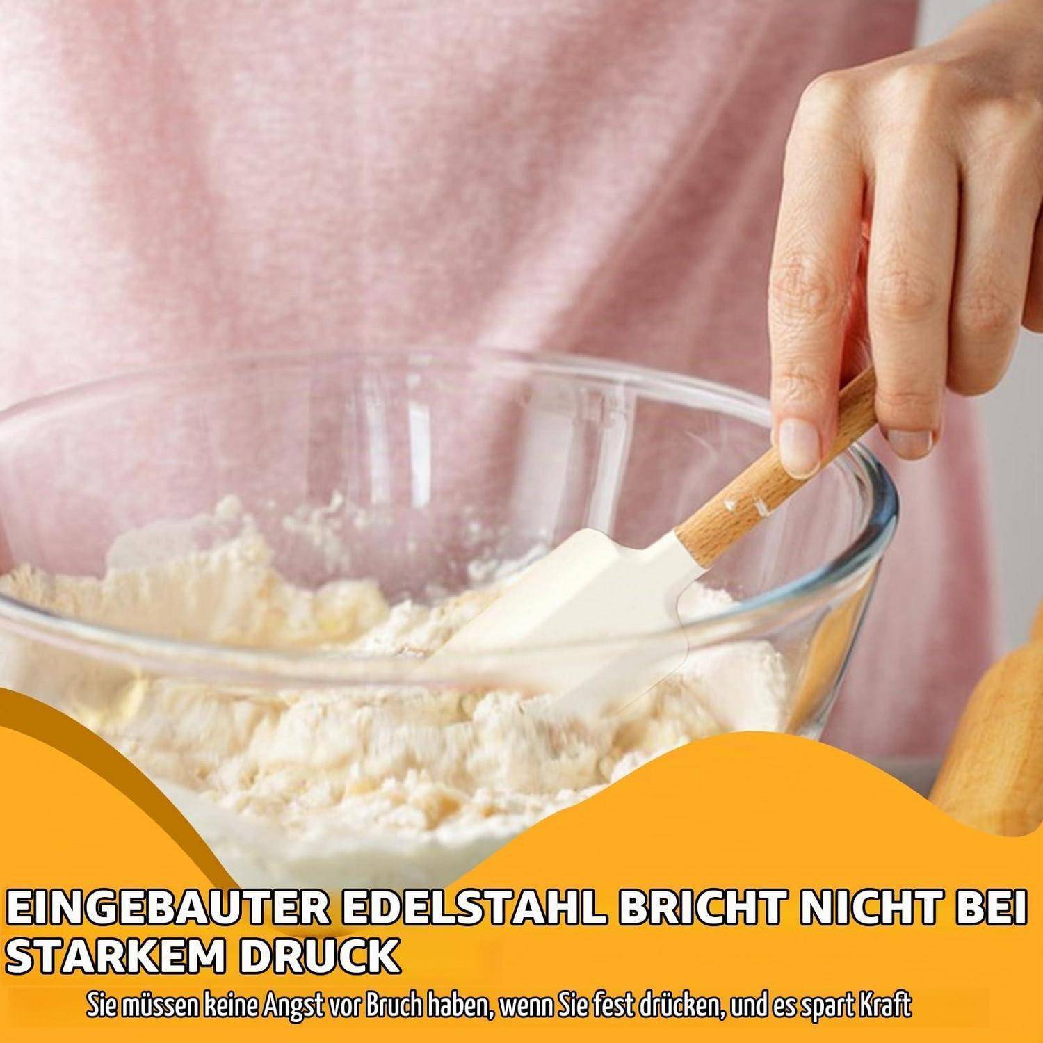 Person rührt Teig in einer Glassschüssel mit einem Spatel um; Deutscher Text besagt, dass eingebauter Edelstahl unter starkem Druck nicht bricht und Kraft spart.
