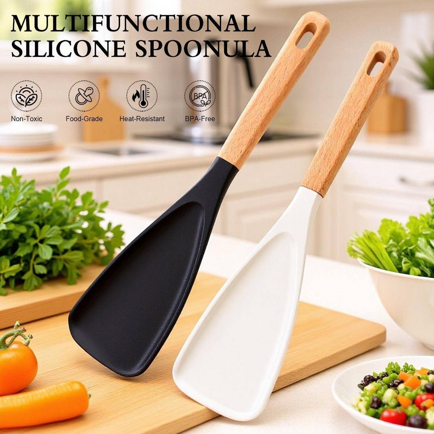 Produktbild von zwei multifunktionalen Silikonspachtelöffeln mit Holzgriffen, einer schwarzen und einer weißen, gekennzeichnet als ungiftig, lebensmittelecht, hitzebeständig und BPA-frei.