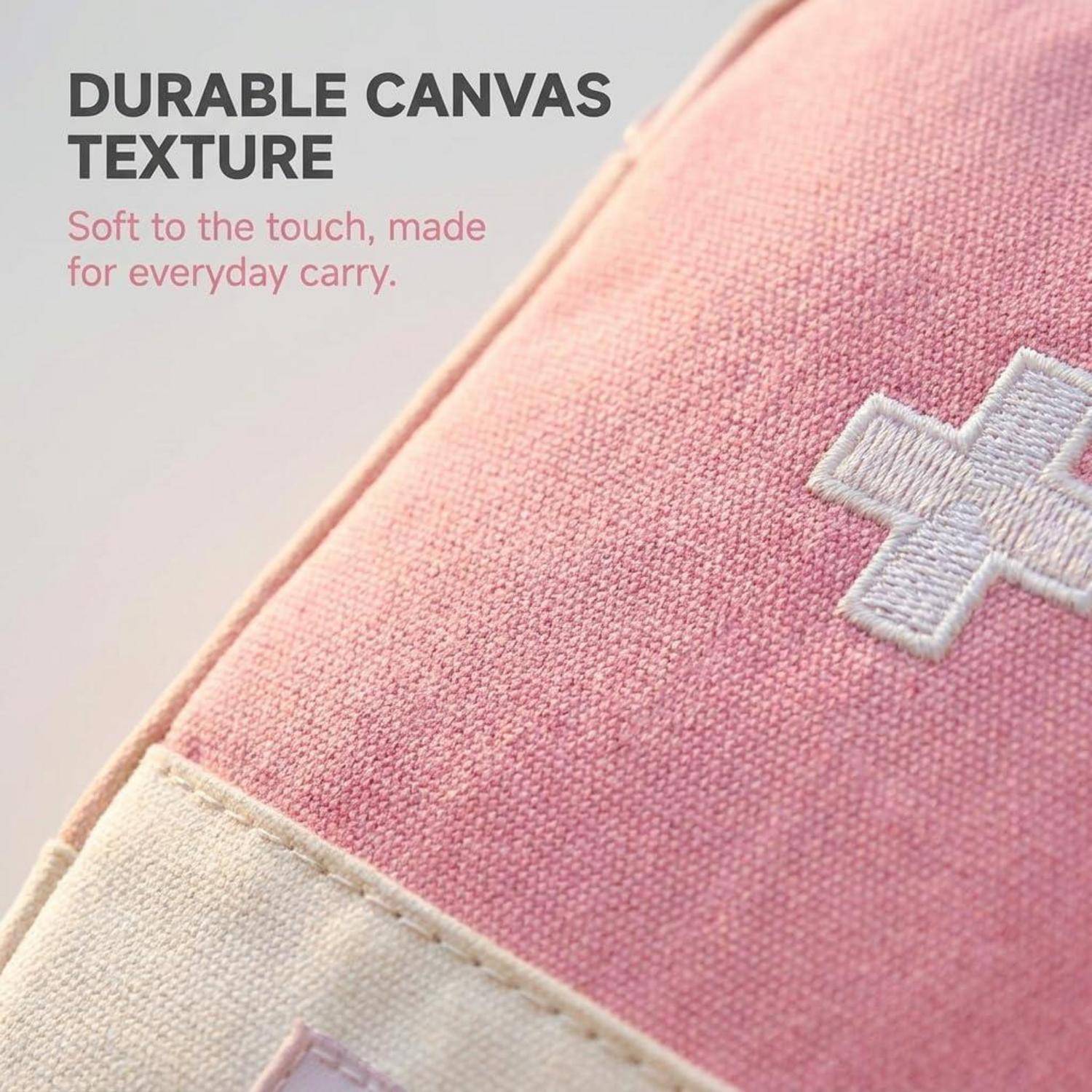 Nahaufnahme einer rosa Leinwandtasche mit langlebiger strukturierter Oberfläche und einem weiß bestickten Kreuz, mit Text „LANGLEBIGE LEINWANDSTRUKTUR" und „Sanft zur Berührung, entwickelt für den täglichen Gebrauch."