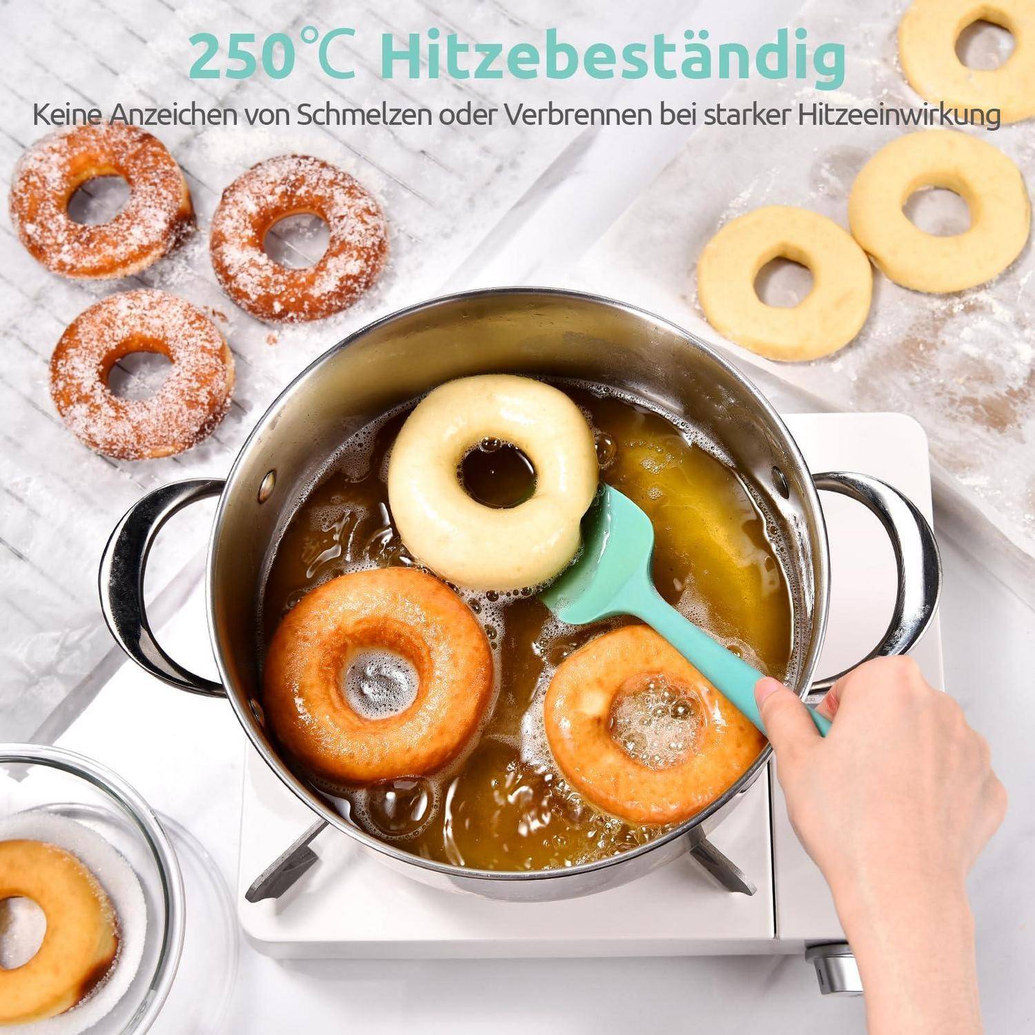 Heiße Donuts braten in einem Topf auf einem Kochfeld, mit deutschem Text, der besagt „250°C Hitzebeständig
