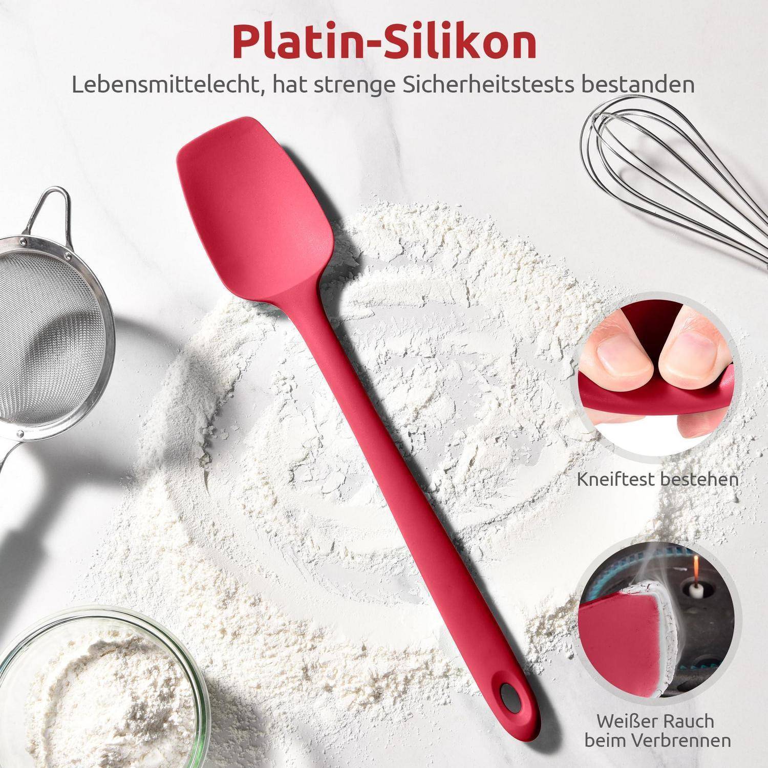 Roter Platinsilikon-Spatel auf Mehl mit Sieb, Schneebesen und Schüssel; deutscher Text besagt lebensmittelecht, bestand strenge Sicherheits- und Schneidetests und kein weißer Rauch beim Verbrennen.