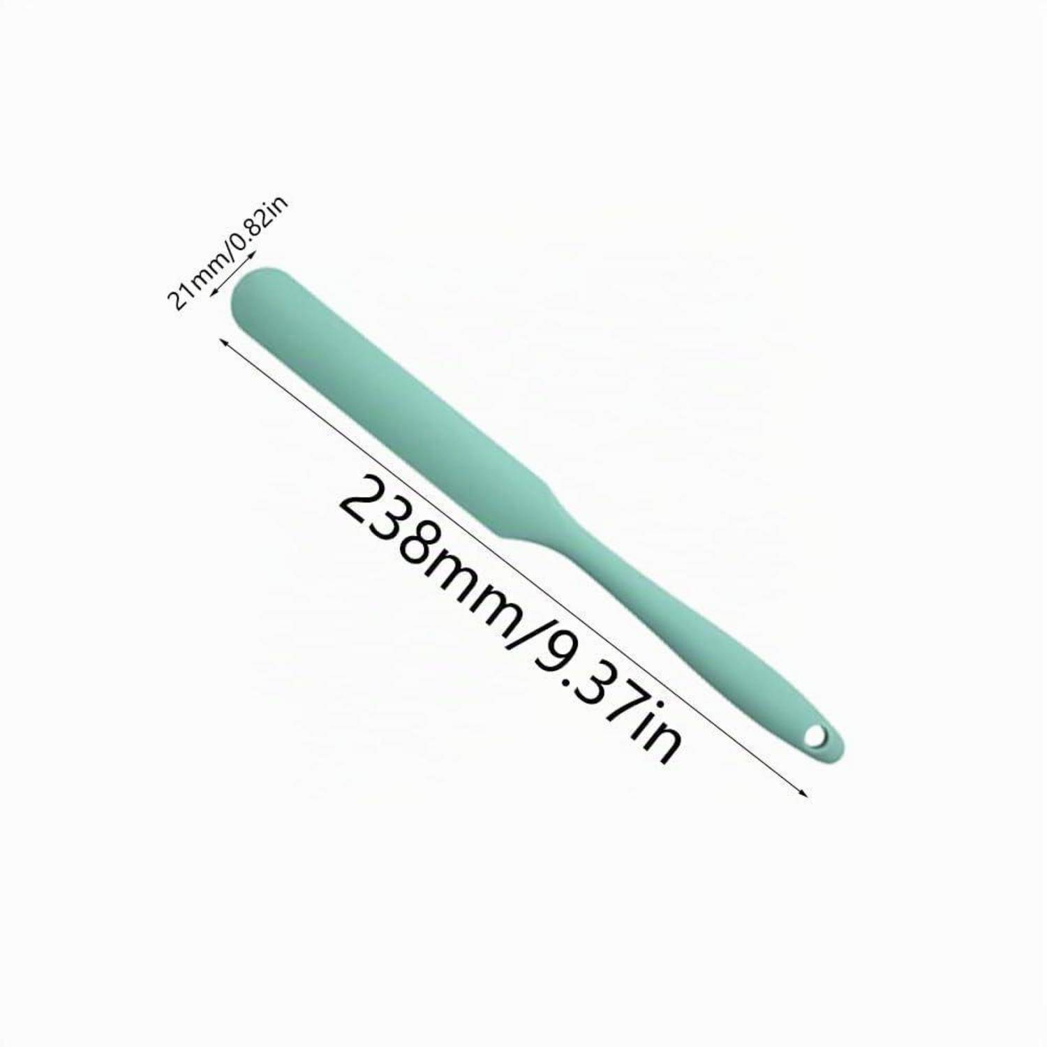Mintgrünes silikonartiges Spatel-ähnliches Werkzeug mit Aufhängeloch, diagonal dargestellt und mit 238 mm/9,37 Zoll Länge und 21 mm/0,82 Zoll Breite gekennzeichnet.