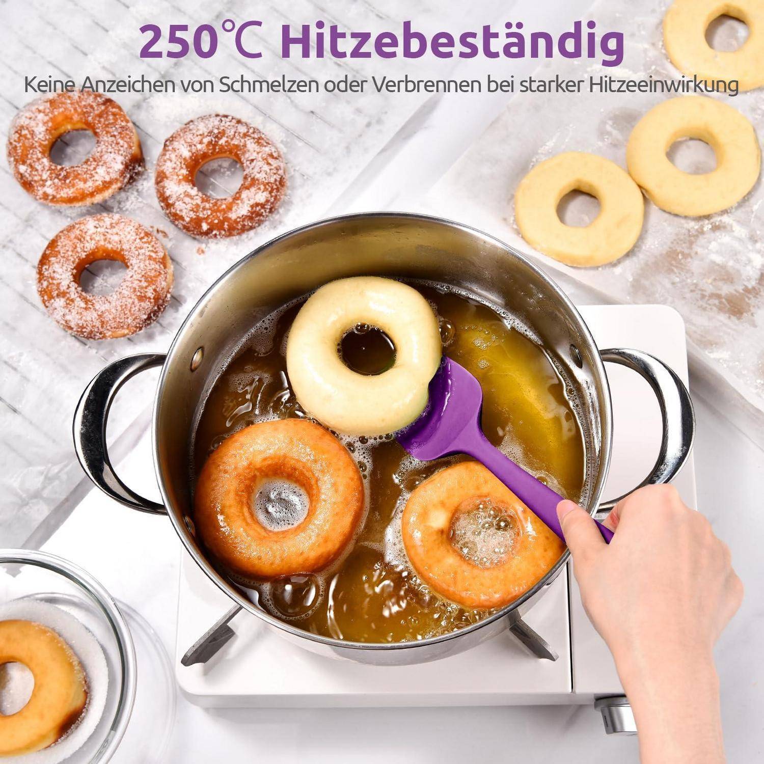 Donuts braten in einem Topf auf einem Herd, mit einer Hand, die einen violetten Spatel benutzt; deutscher Text sagt „250°C hitzebeständig