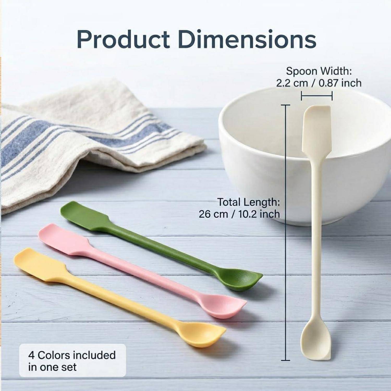 Produktabmessungs-Grafik mit einem 26 cm langen Löffel mit 2,2 cm Breite, plus vier enthaltene Farben: grün, rosa, gelb und creme.