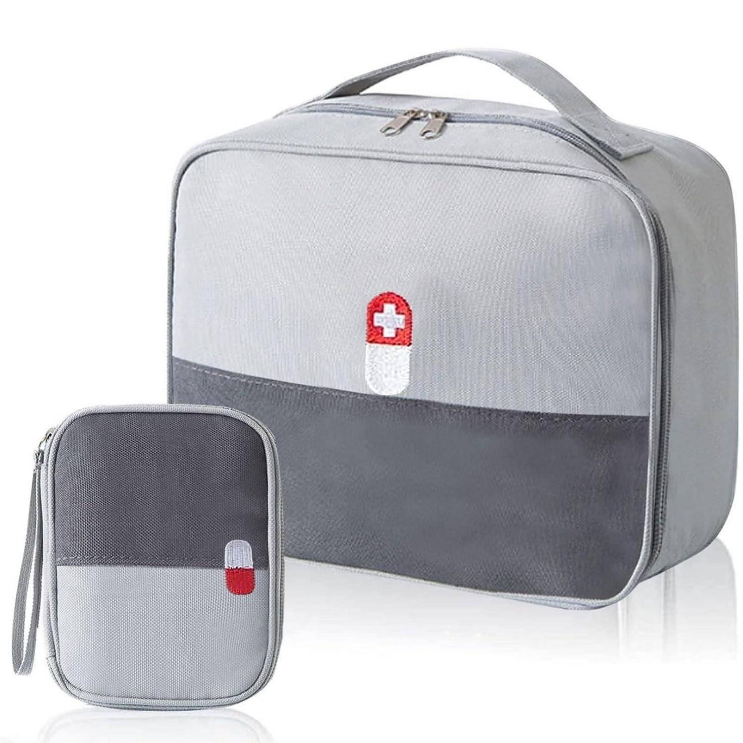 Graue isolierte Kühlertasche und passende kleinere Tasche mit rotem und weißem Erste-Hilfe-Kreuz-Emblem