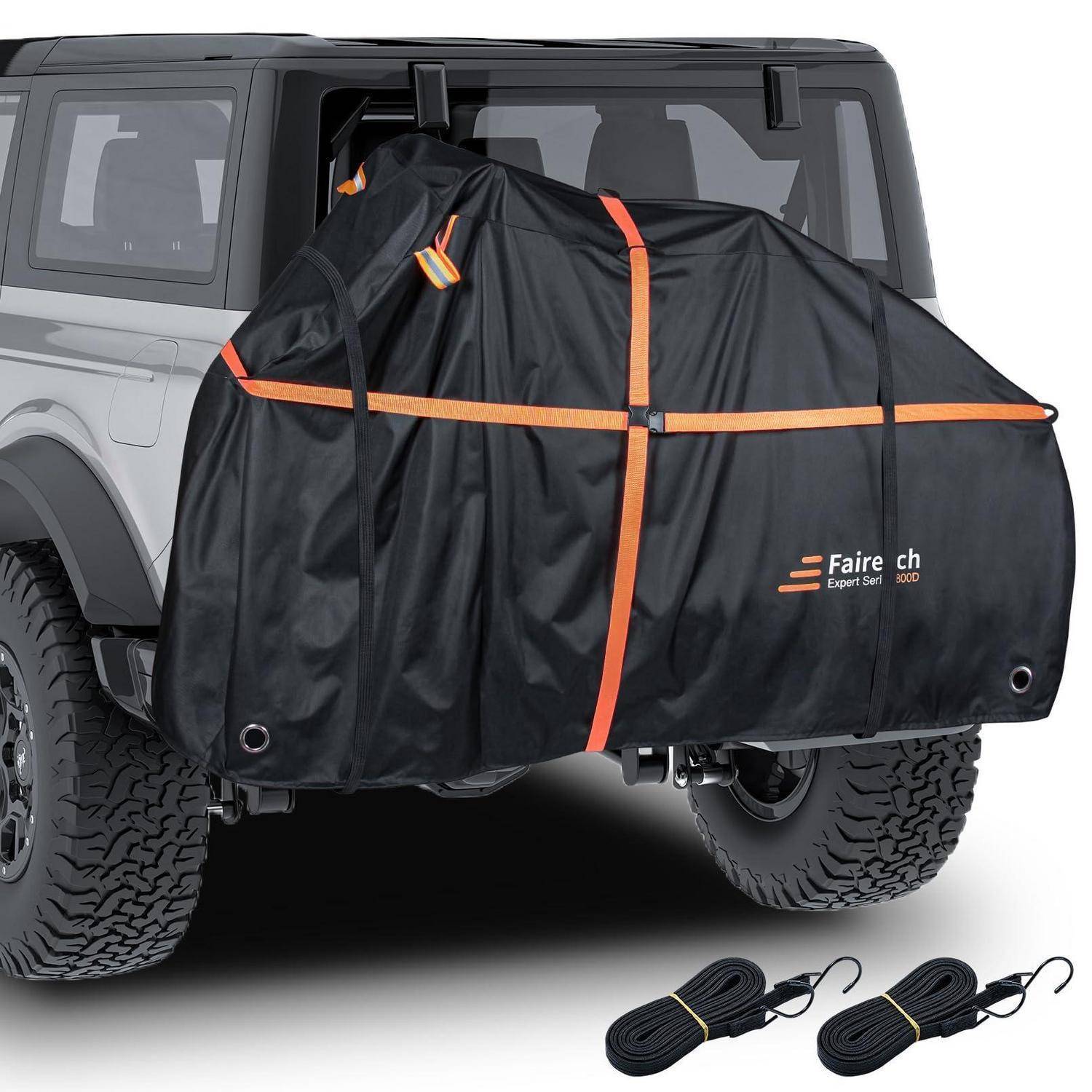 Schwarze hintere Ladeflächen-Abdeckung oder Zelt, das an einem jeepähnlichen SUV befestigt ist, mit orangefarbenen Riemen gesichert, mit zwei aufgewickelten Spanngurten, die unten abgebildet sind.