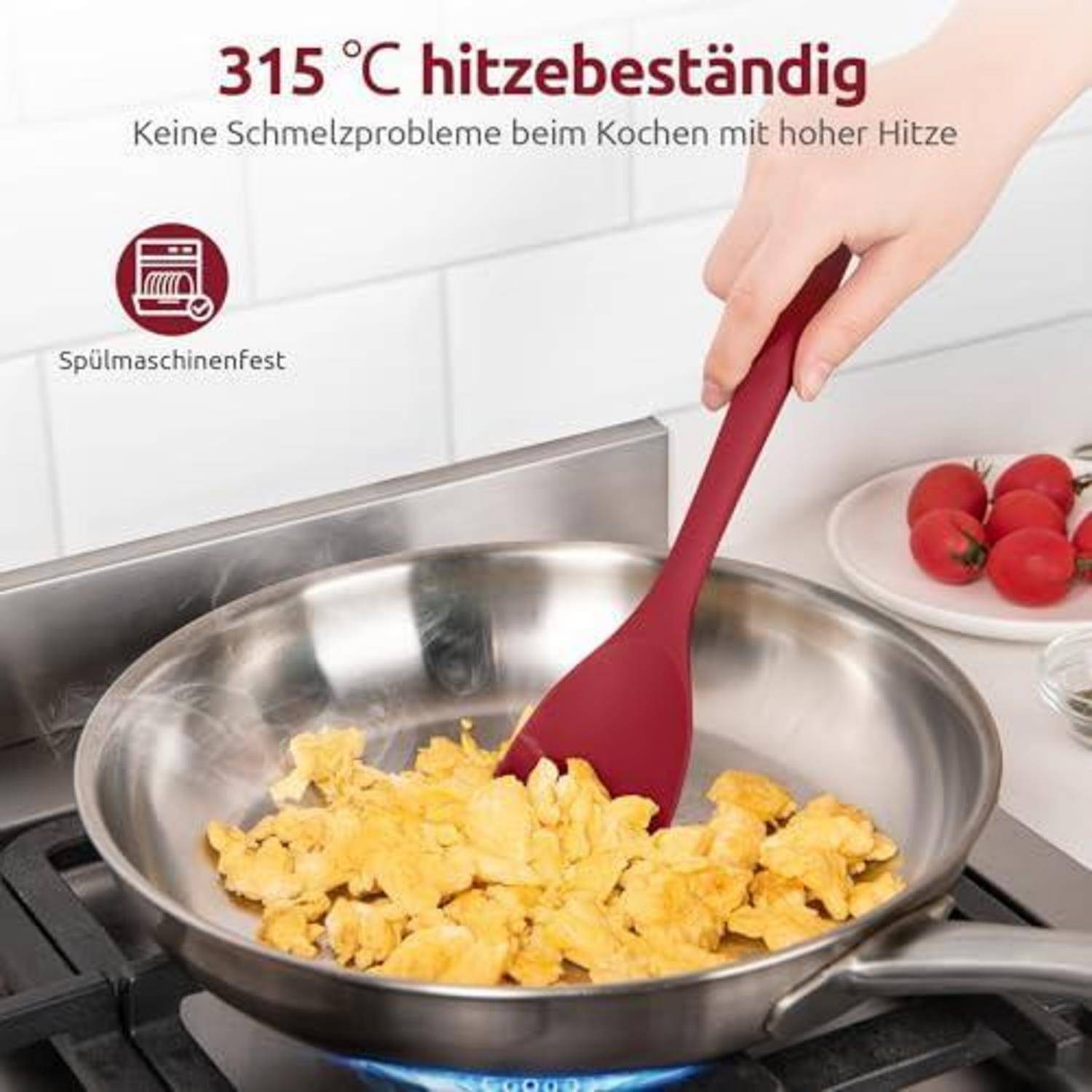 Rühren von Rühreier in einer Edelstahlpfanne mit einem roten Spatel von Hand; deutscher Text besagt „315°C hitzebeständig