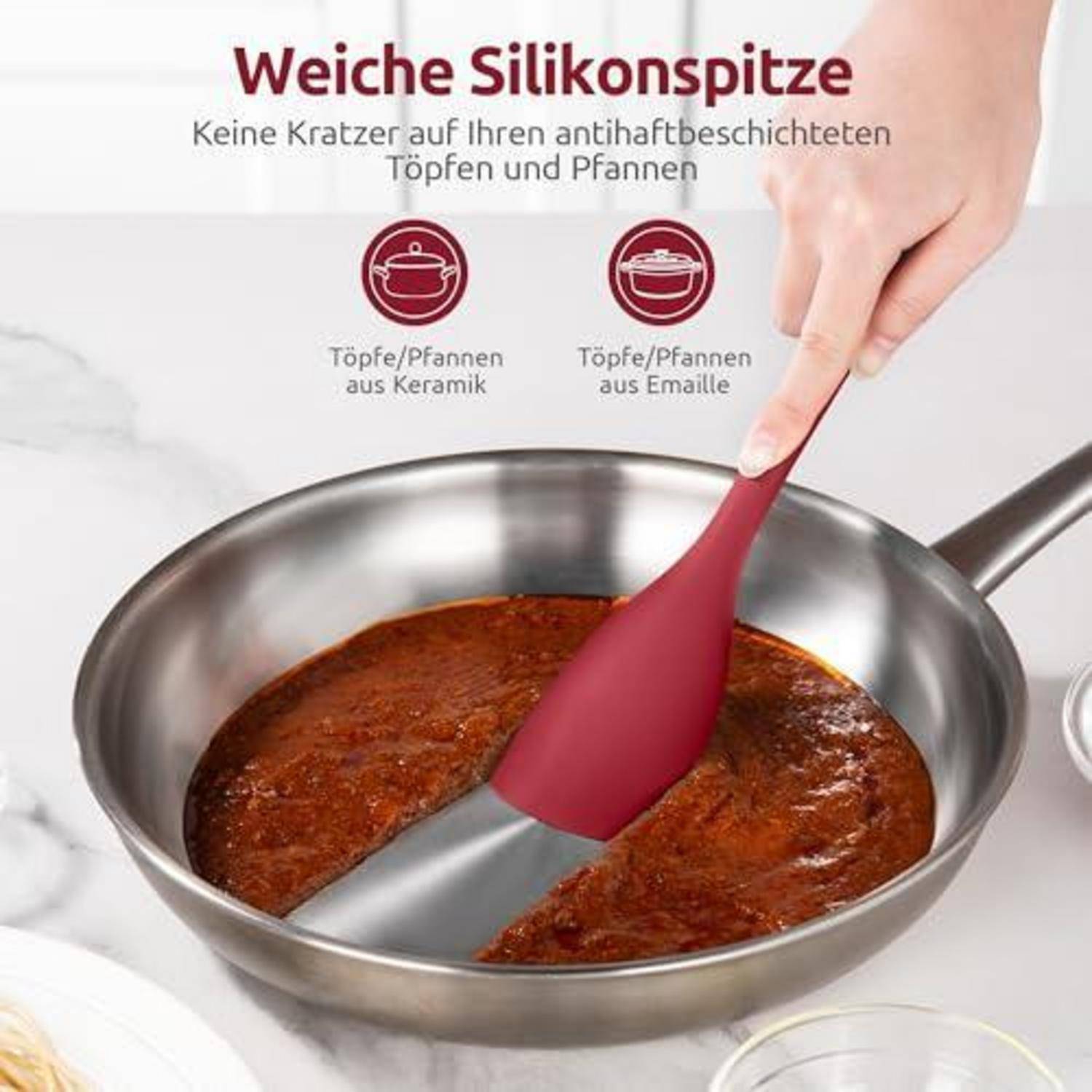 # Silikonspatel zum Kochen in einer Edelstahlpfanne mit deutschem Text, der weiche Silikonspitzen bewirbt, die Keramik- oder Emailletöpfe und -pfannen nicht zerkratzen.