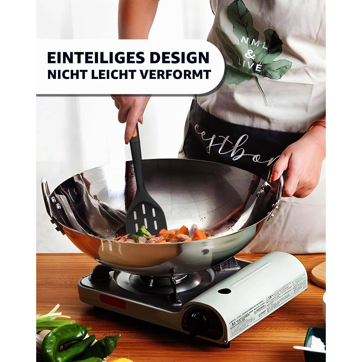 Person kocht Gemüse in einem Wok auf einem tragbaren Herd; Text besagt „Einteiliges Design, nicht leicht verformt