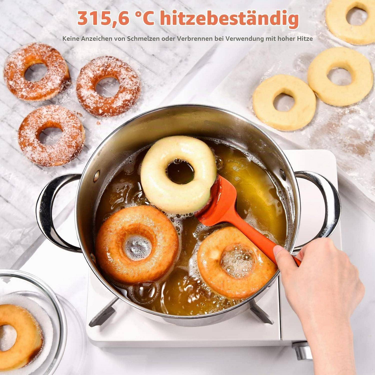 Topf mit heißem Öl auf einer Kochplatte brät ringförmige Donuts; Text sagt „315,6 °C hitzebeständig