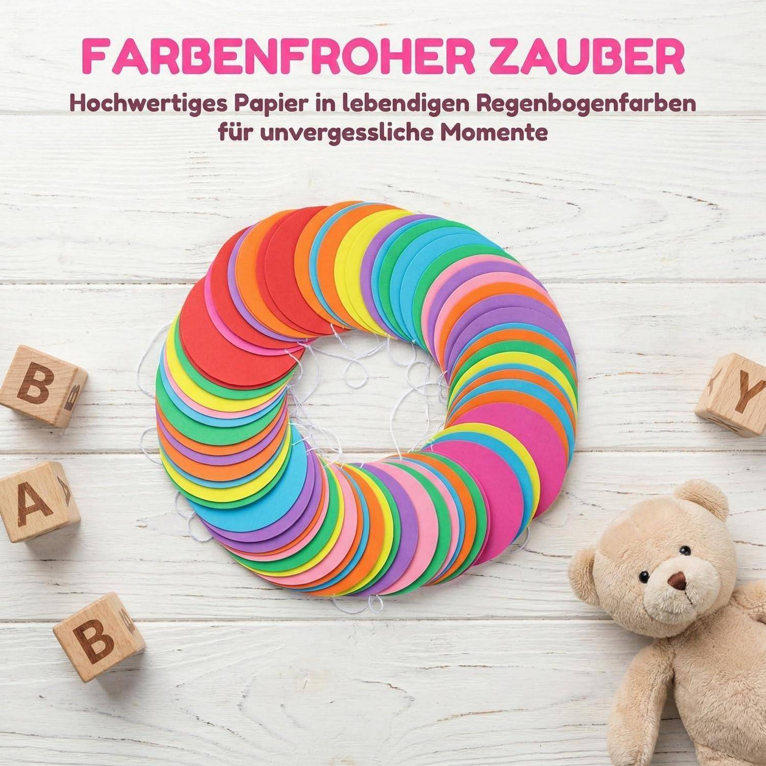 Regenbogenpapierring-Display mit deutschem Text „FARBENFROHER ZAUBER