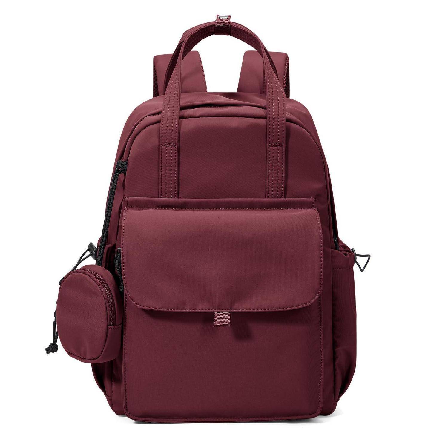 Bordeauxrote Rucksack mit Griffgriff oben, Vorderklappe mit Tasche und kleiner runder Seitentasche auf weißem Hintergrund.