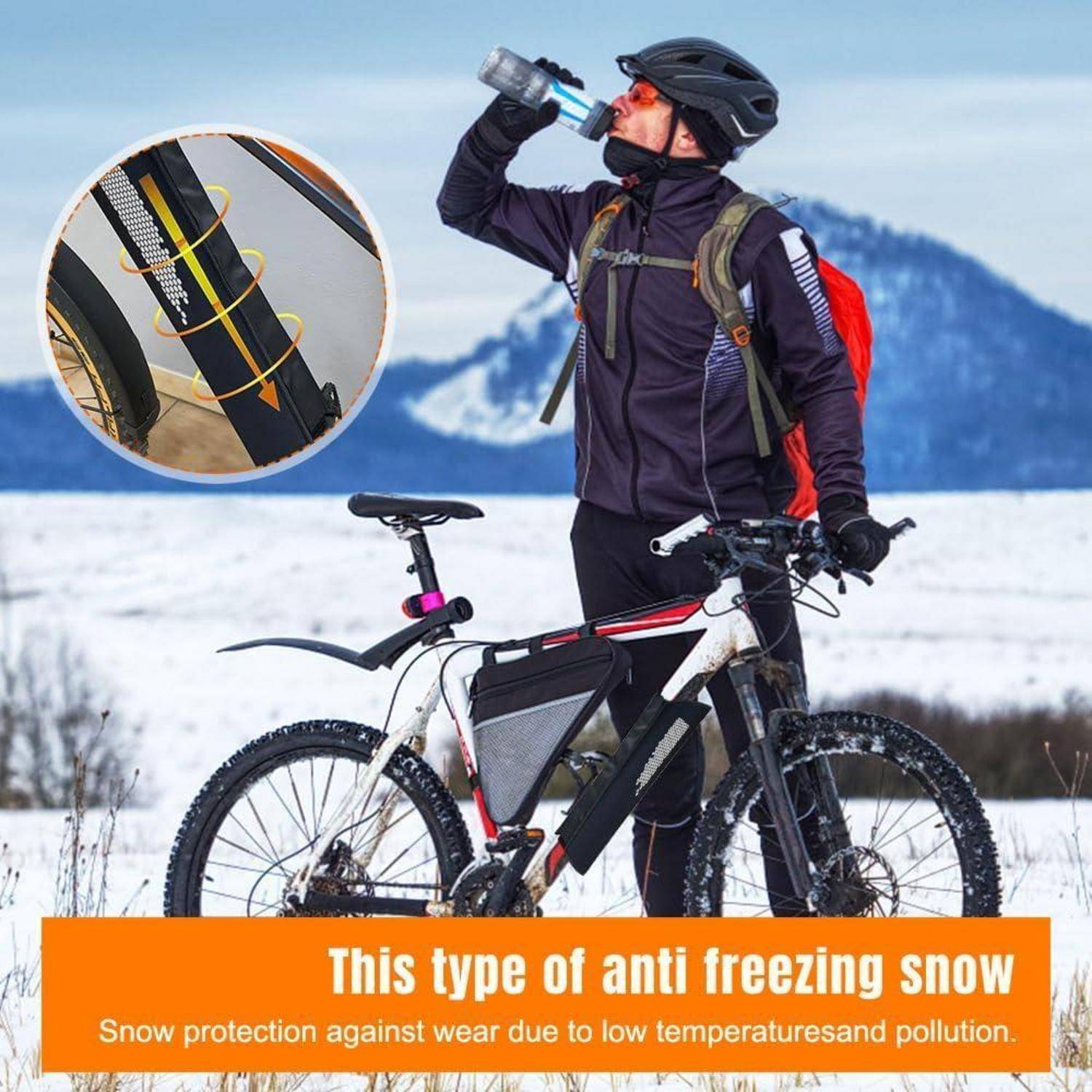 Radfahrer in Winterausrüstung trinkt aus einer Flasche neben einem Mountainbike im Schnee; die Vergrößerung zeigt ein gerahmtes Rohr, das zum Frostschutz mit Schneepolsterung verpackt ist.