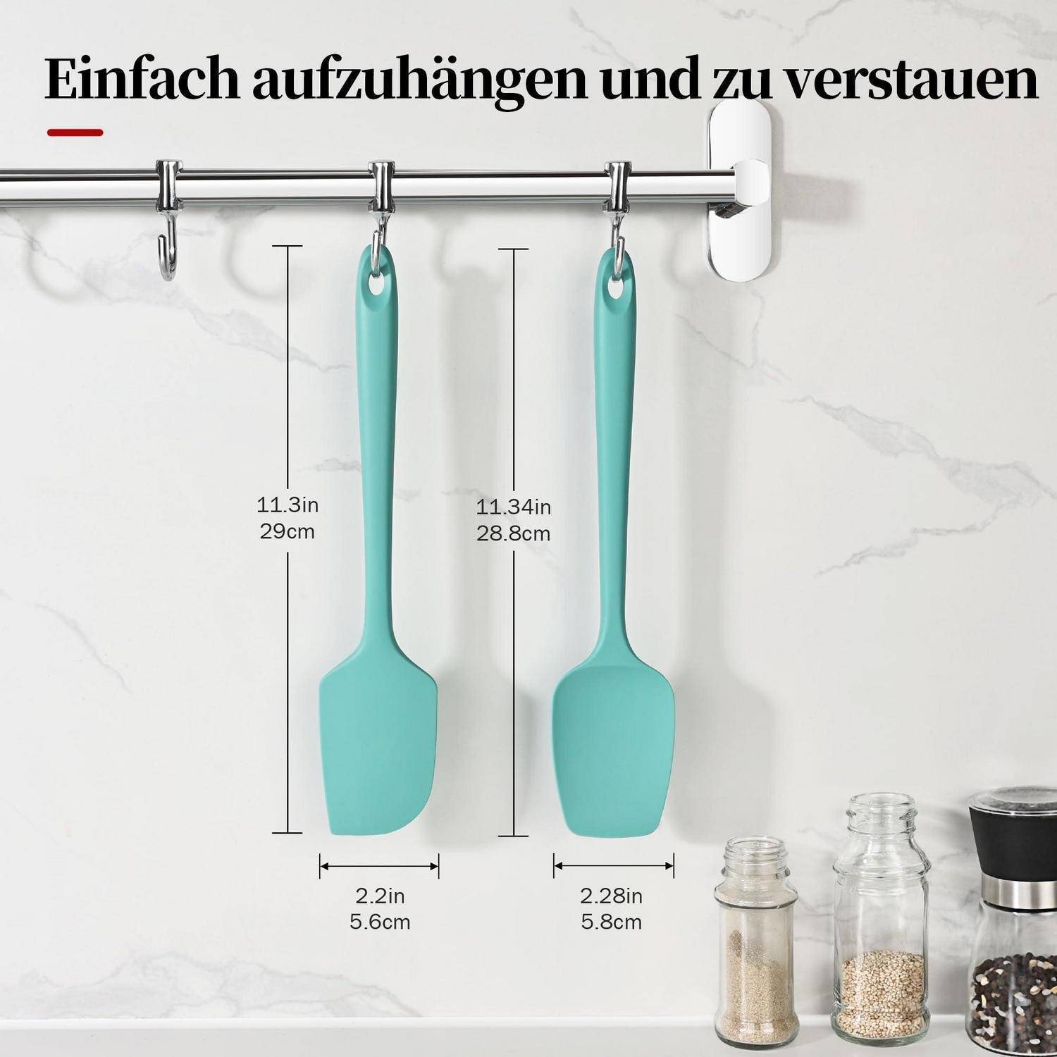 Produktbild mit zwei türkisfarbenen Silikon-Spachteln, die an einem wandmontierten Metallregal hängen, mit gekennzeichneten Abmessungen von 11,3 Zoll und 11,34 Zoll Länge.