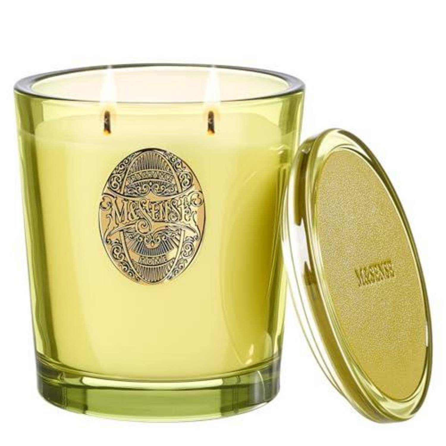 Gelbe Duftkerze aus Glas mit zwei Dochten und dekorativem rundem Etikett, gezeigt mit ihrem passenden Deckel daneben.