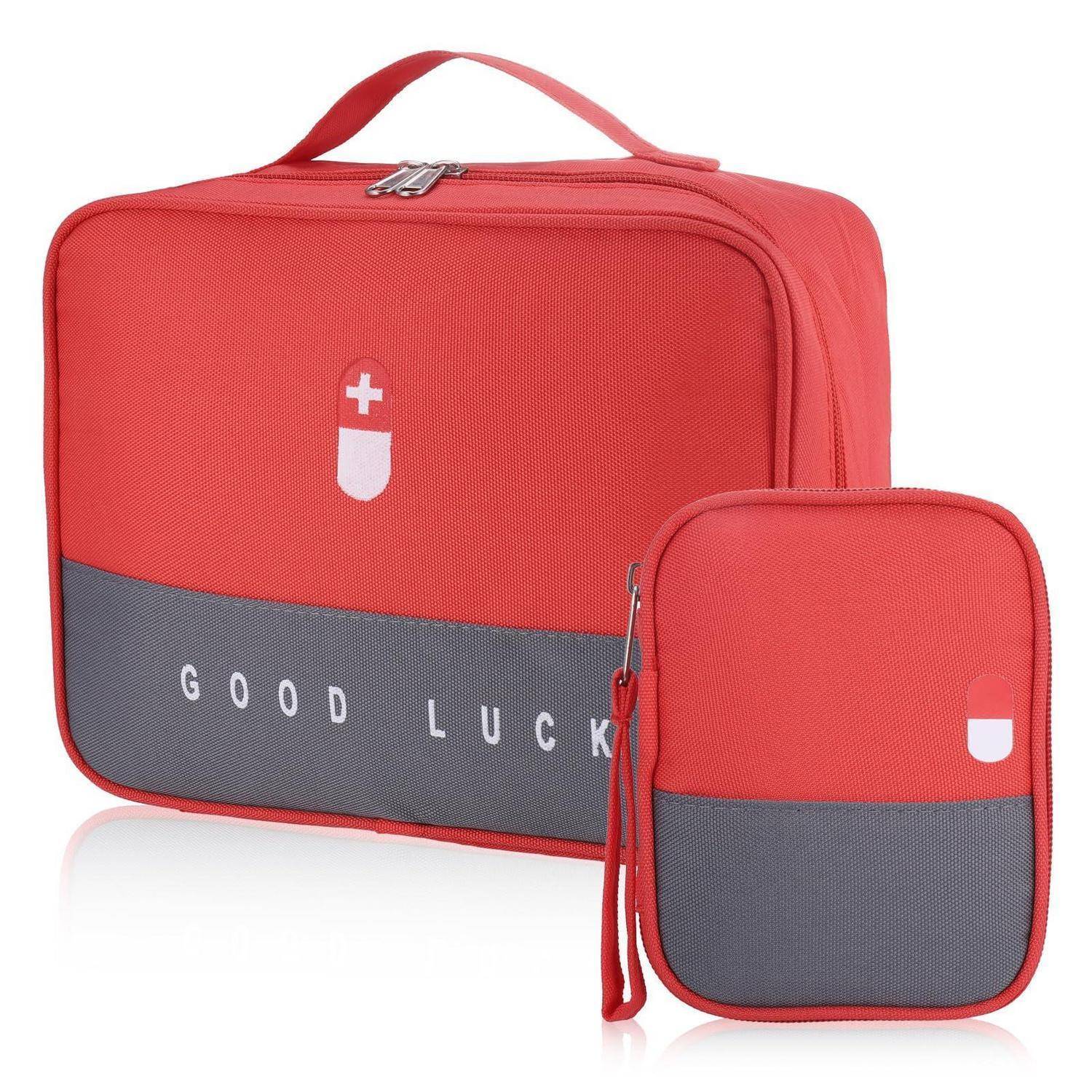 Rot- und grau isoliertes Tascheset mit einer größeren Lunchbox und passendem kleinem Beutel, mit weißem Kreuzzeichen und 