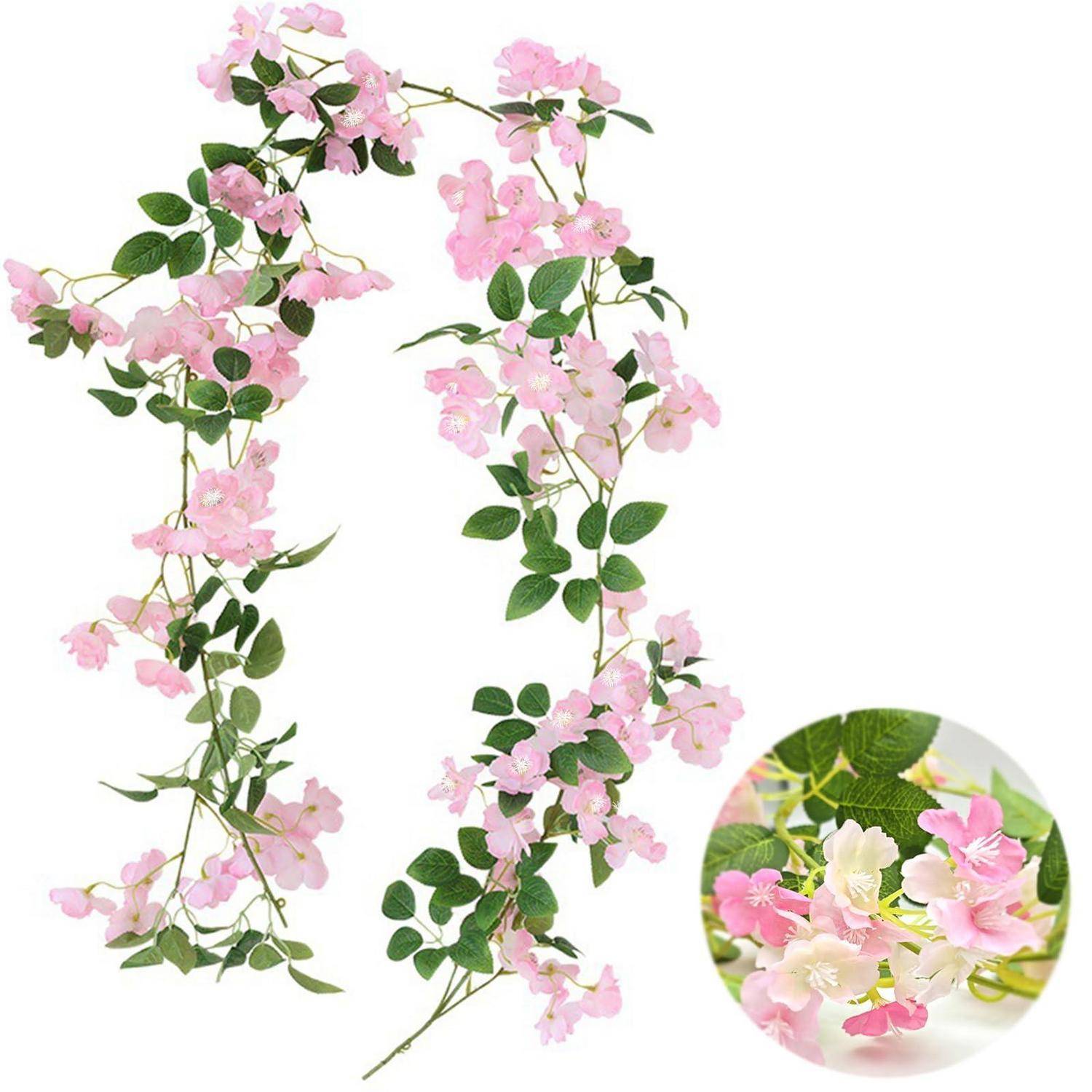 Zwei hängende Girlanden mit rosa und weißen künstlichen Blüten mit grünen Blättern, plus eine Nahaufnahme mit Details der Blüten.