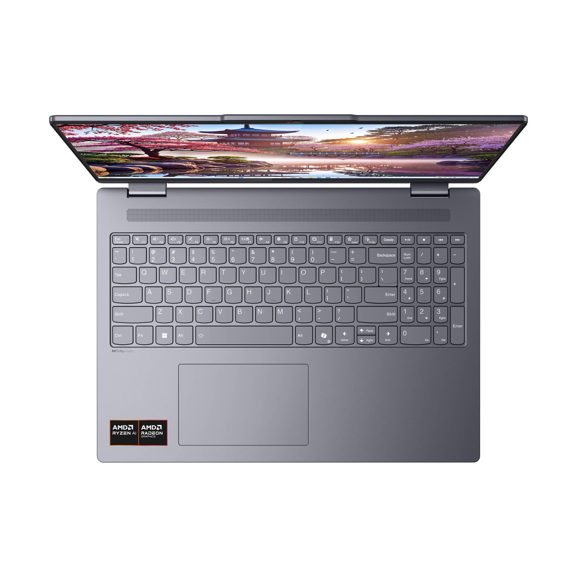 Draufsicht auf einen offenen grauen Laptop mit vollständiger Tastatur, großem Trackpad und farbenfroher Landschaft auf dem Bildschirm.
