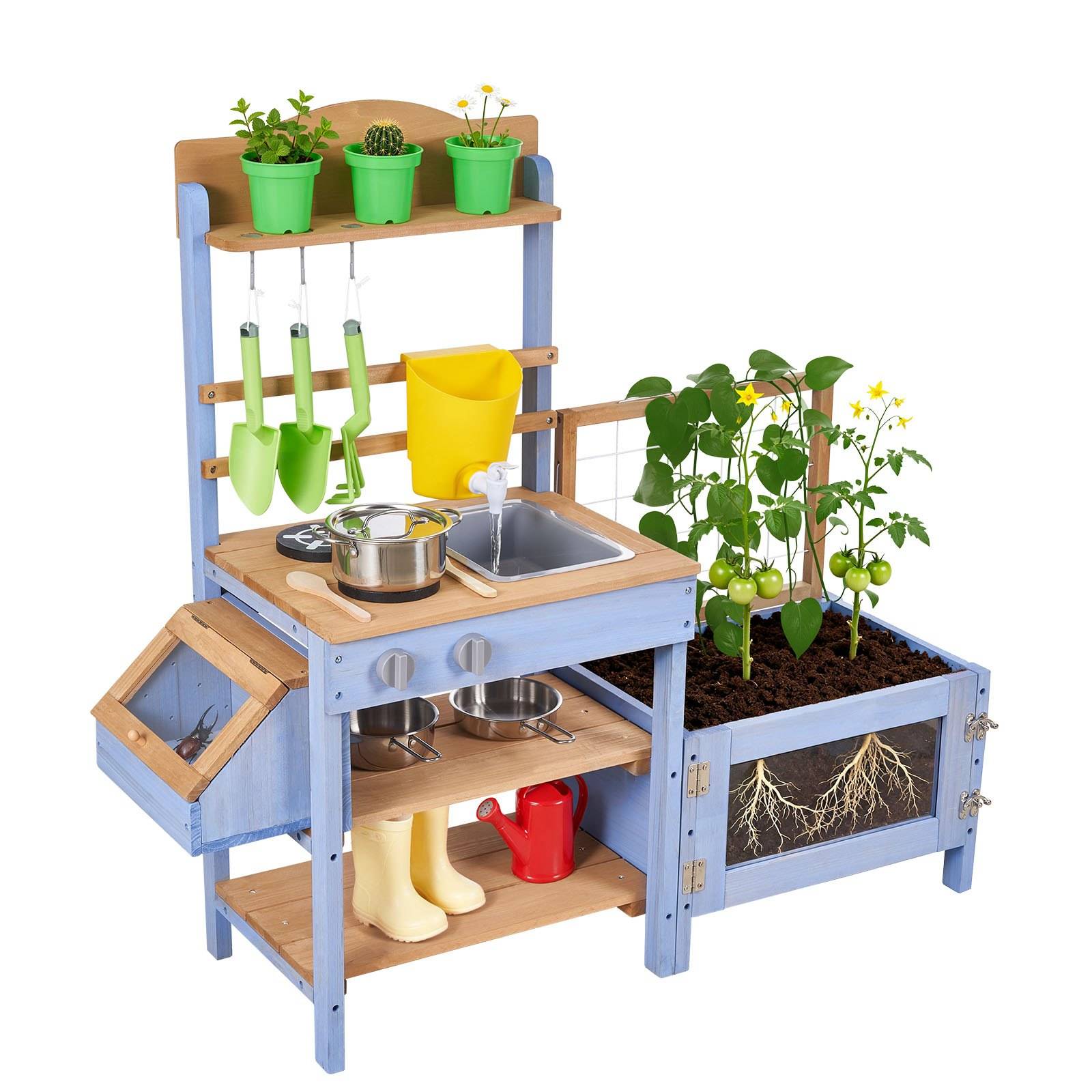 Kinder-Spielgartenkitchen mit Topfpflanzen, Schaufeln, Spüle und wachsenden Tomaten in einem Blumenbeet mit sichtbaren Wurzeln.