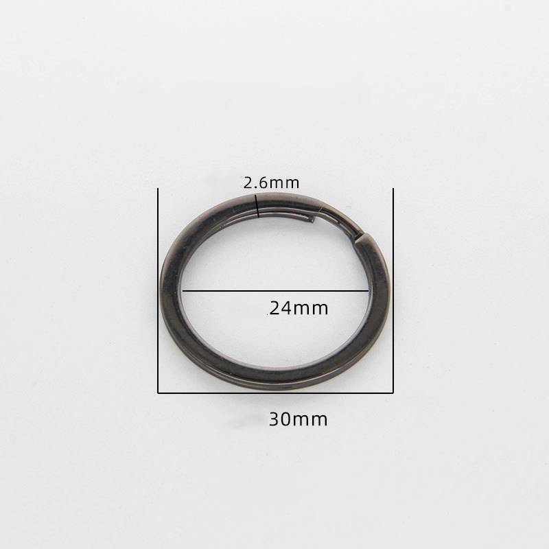 Dunkler Metallspaltring mit Abmessungen: 30 mm Außendurchmesser, 24 mm Innendurchmesser und 2,6 mm Dicke.
