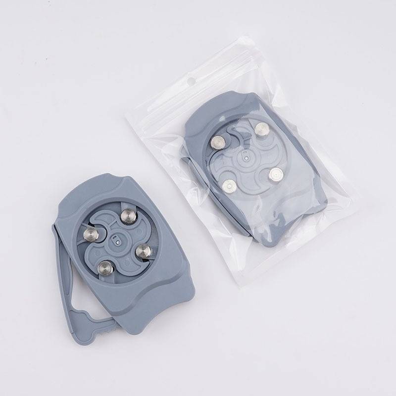 Zwei graue magnetische Klippvorrichtungen auf weißem Hintergrund, eine lose und eine in einem durchsichtigen Plastikbeutel versiegelt.