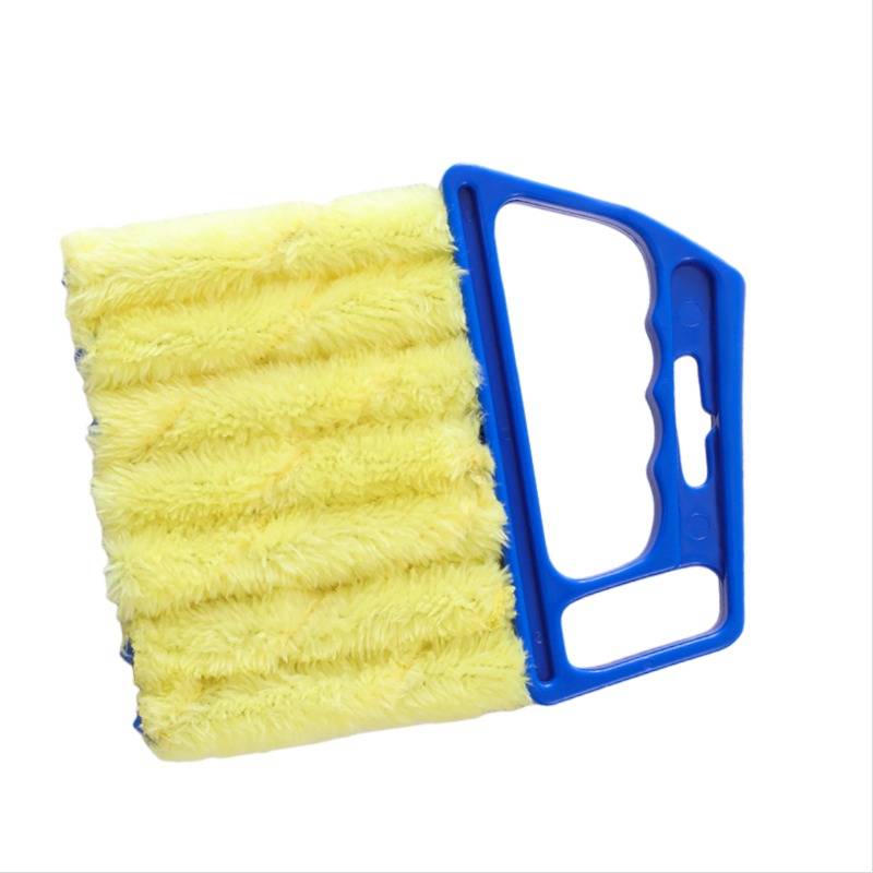 Gelbe Reinigungsbürste mit blauem Kunststoffgriff auf weißem Hintergrund.