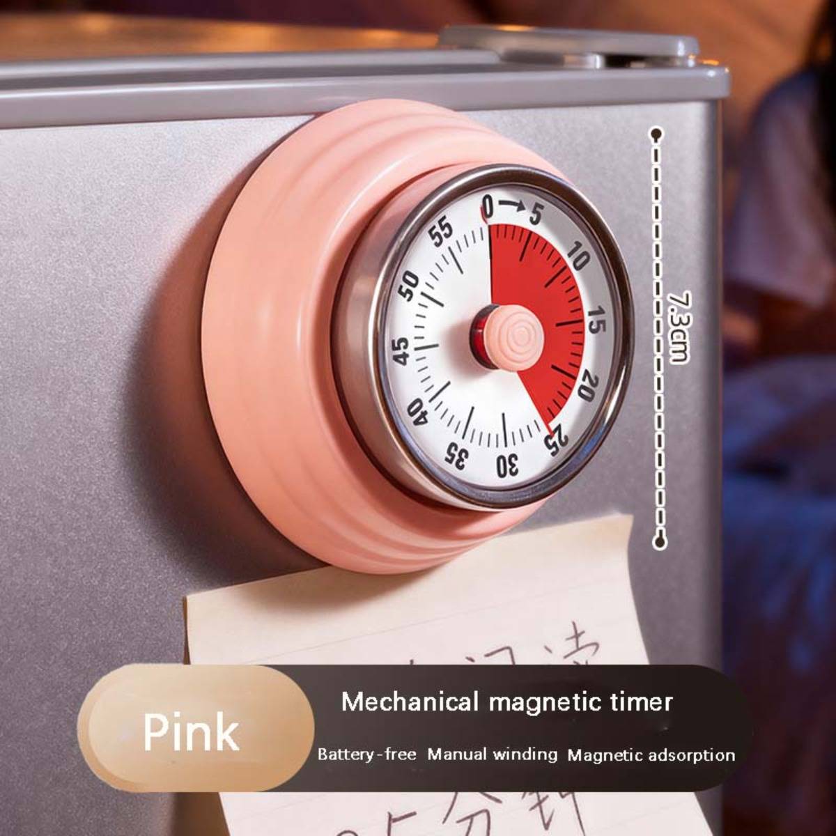 Rosa mechanischer Magnetischer Timer mit einem 7,3 cm Zifferblatt, gezeigt befestigt an einer Metallfläche.