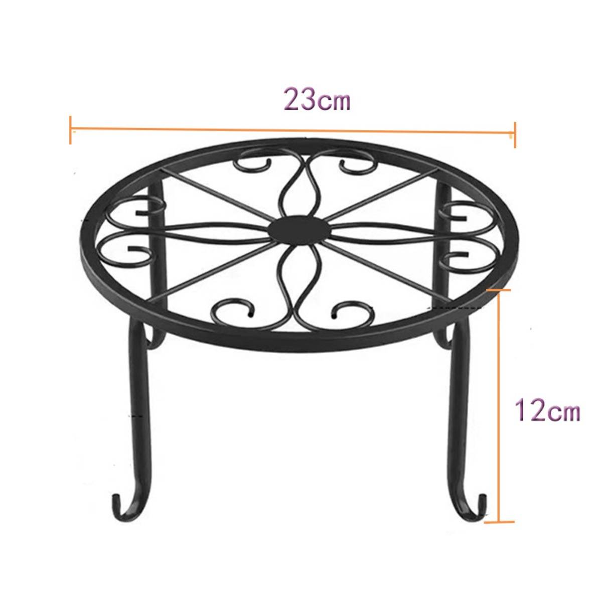 Rundes schwarzes Metallpflanzenständer mit verzierter Oberseite, 23 cm breit und 12 cm hoch.