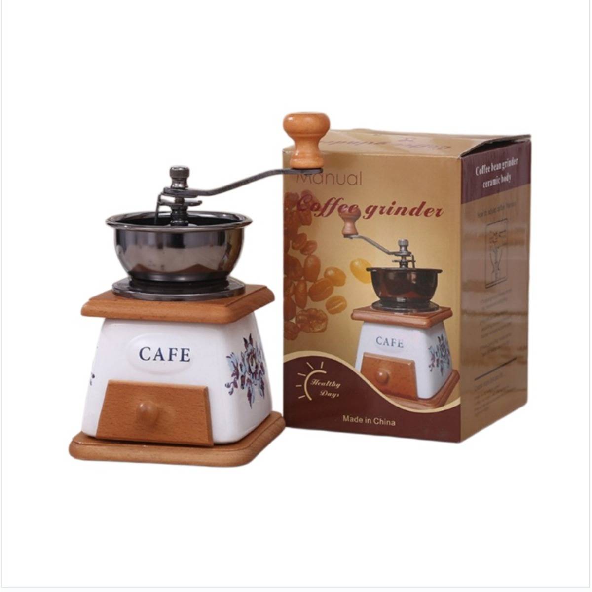Manuelle Kaffeemühle mit Keramikkörper, Holzsockel und Griff, abgebildet neben ihrer Produktschachtel mit der Beschriftung „Kaffeemühle