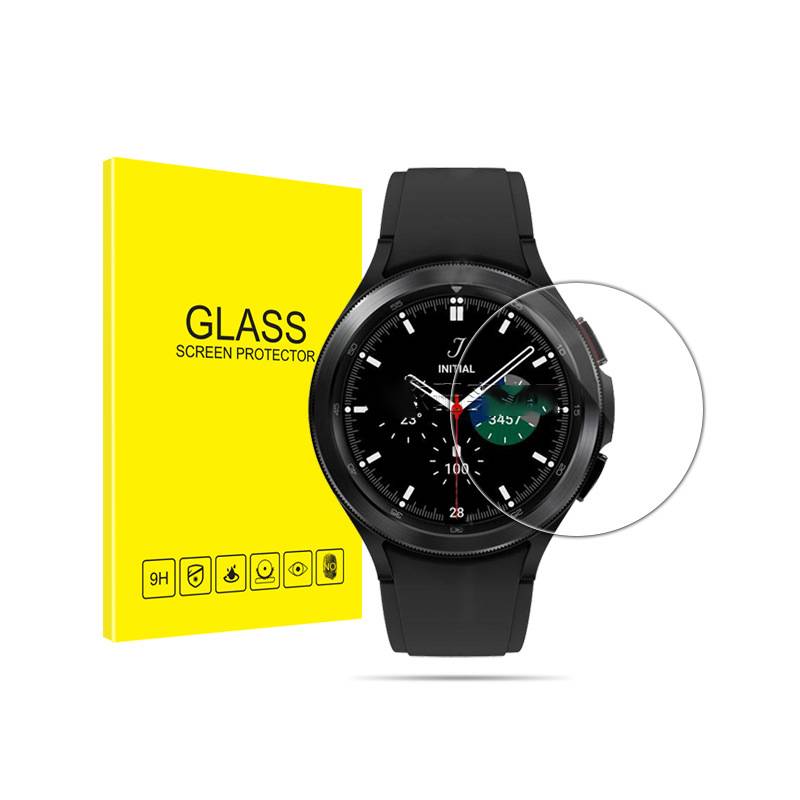 Schwarze Smartwatch neben einer gelben Packung 