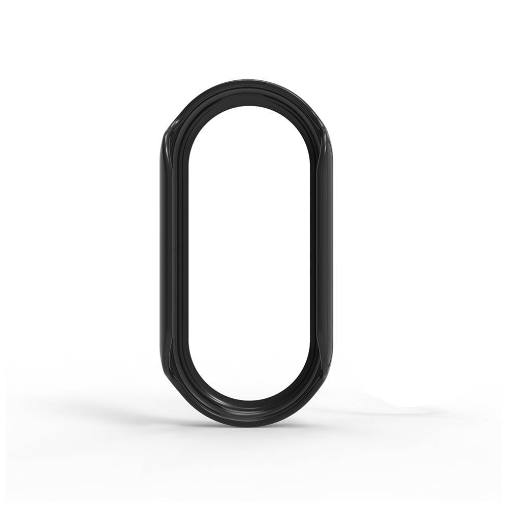 Schwarzer ovaler ringförmiger Gegenstand, der aufrecht auf weißem Hintergrund steht, mit einem Schatten darunter.